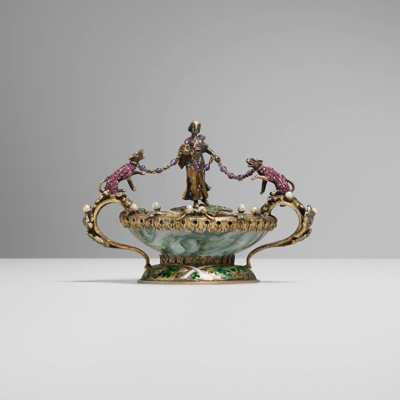 Hermann Bohm, attribution, Diana the Huntress sweetmeat dish: Hermann Bohm, attribution Diana the Huntress sweetmeat dish Austria, 1866-1922 silver gilt, ruby, emerald, sapphire, amethyst, moss agate, pearl, enamel 3.5 h x 5 w x 3.75 d in (9 x 13 x 10 cm) 