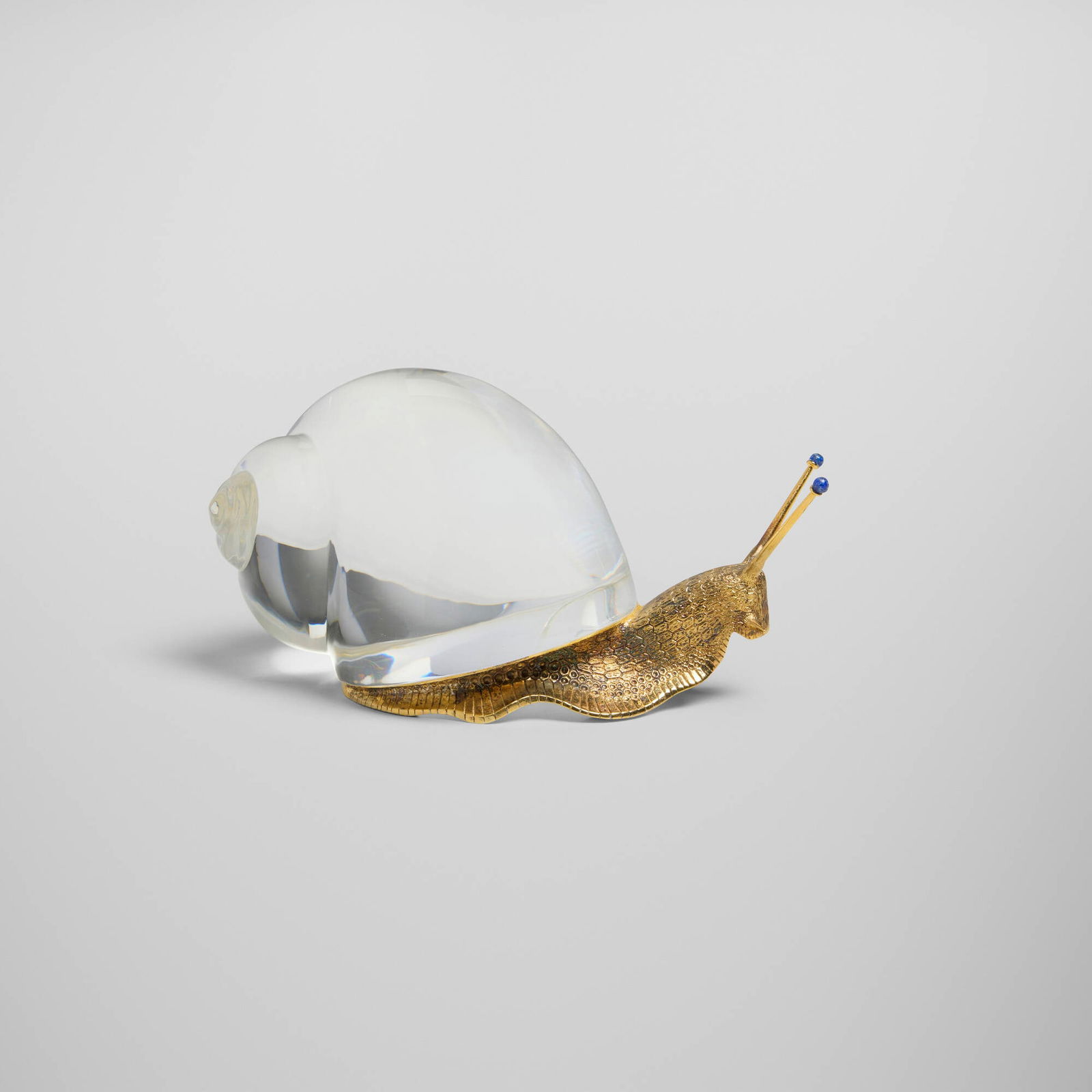 Paul Schulze for Steuben, Snail: Paul Schulze for Steuben Snail USA, 1971 lead glass, sterling silver gilt, lapis lazuli 3.5 h x 6.75 w x 3.5 d in (9 x 17 x 9 cm) Incised signature to underside of glass 'Steuben'. Impressed