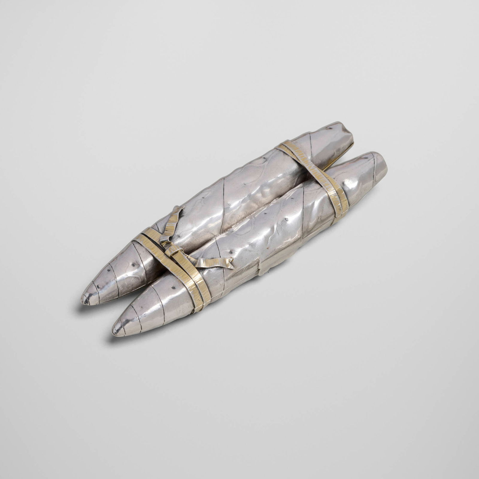 Gorham Manufacturing Company, Trompe-l'?il cigar case: Gorham Manufacturing Company Trompe-l'?il cigar case Providence, USA, c. 1890sterling silver parcel-gilt 0.5 h x 5 w x 1.5 d in (1 x 13 x 4 cm) 1 h x 2 w x 0.5 d in (3 x 5 x 1 cm) Impressed