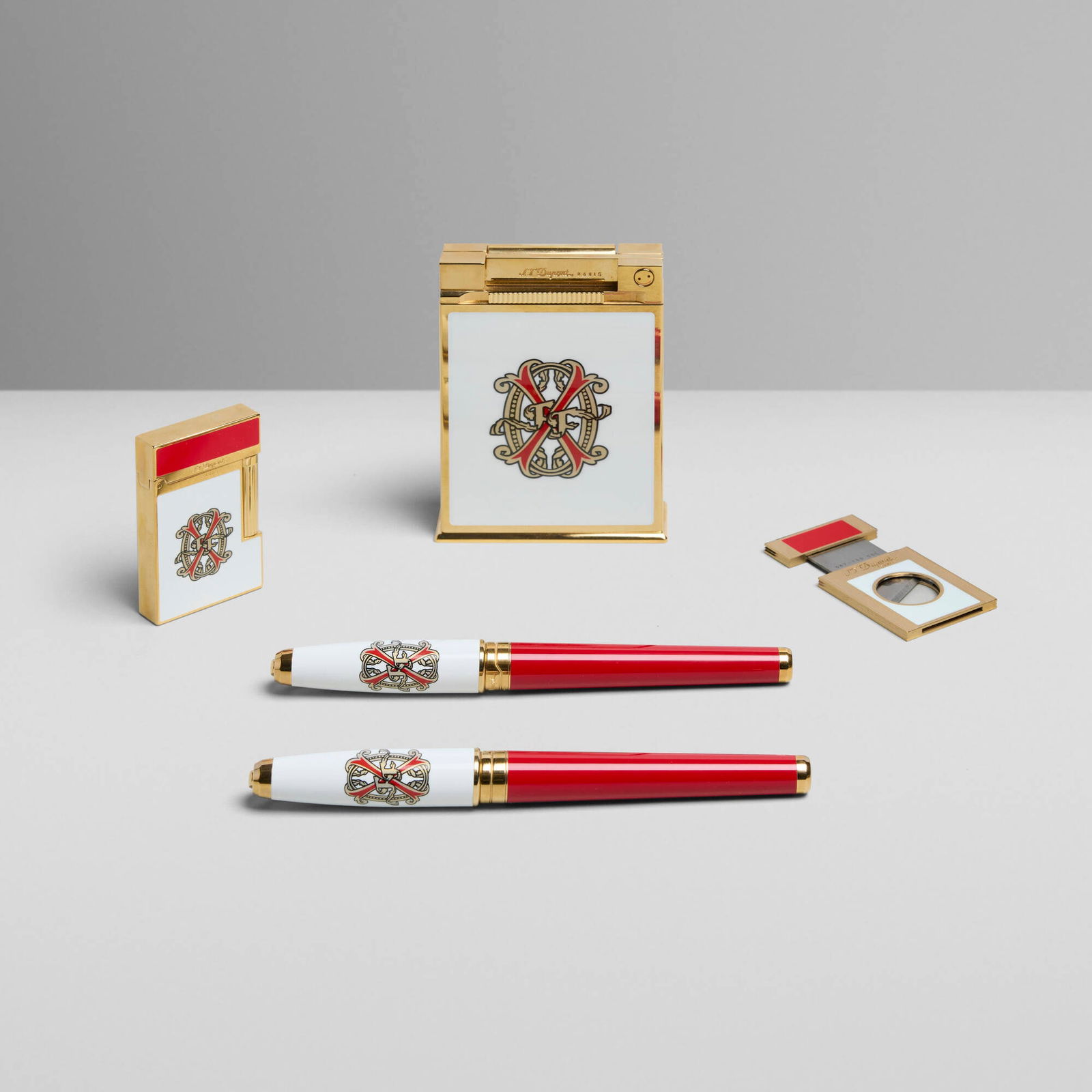 S.T. Dupont, Opus X five-piece collector's set: S.T. Dupont Opus X five-piece collector's set France, 2006 lacquer, gold-plated metal largest: 4 h x 2.75 w x 0.75 d in (10 x 7 x 2 cm) smallest: 2.125 h x 1.375 w x 0.125 d in (5 x 3 x 0 cm) Set