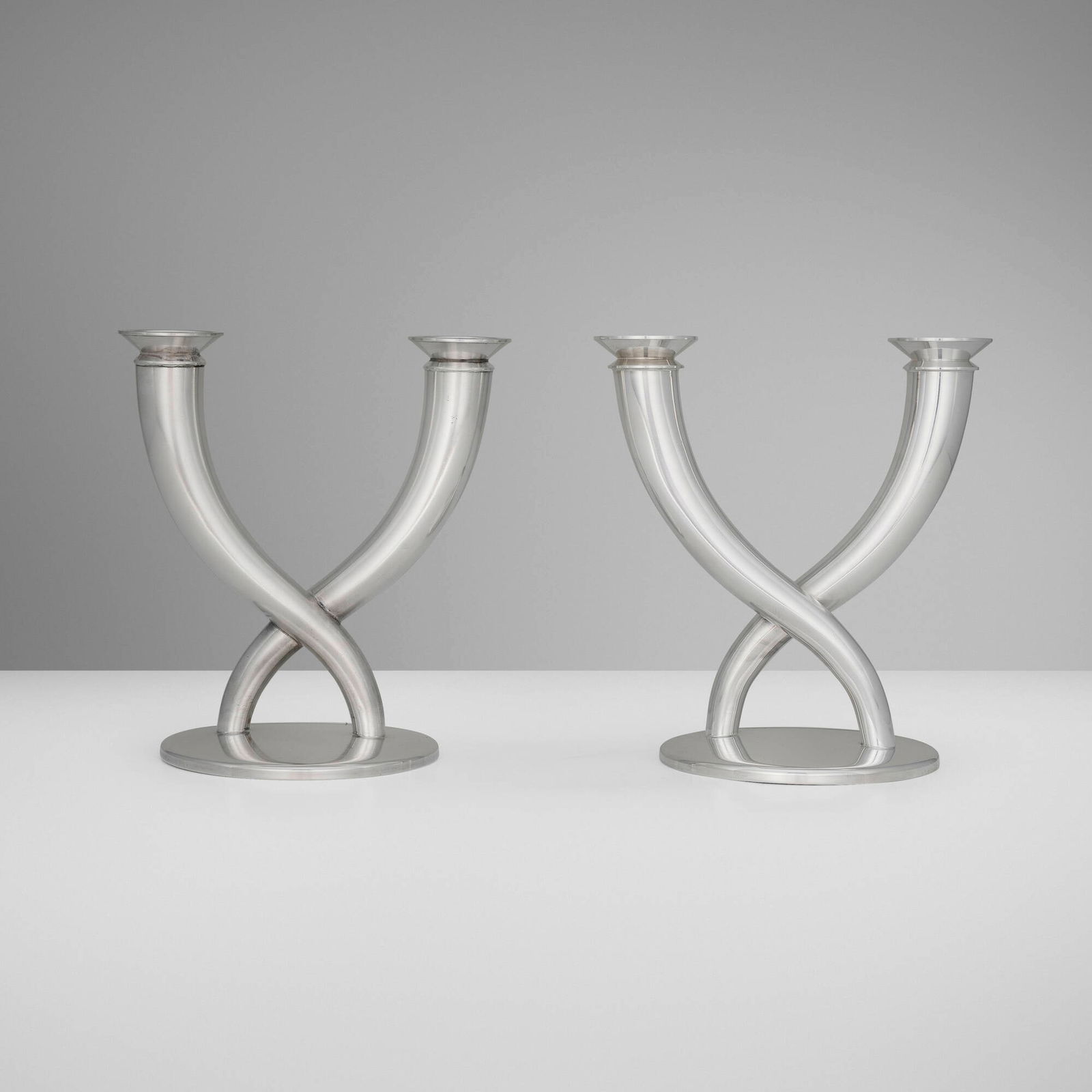 Gio Ponti, Gallia candelabra, pair: Gio Ponti Gallia candelabra, pair ChristofleItaly / France, 1935 / c. 1990silver-plated metal 8 h x 7.75 w x 5.25 d in (20 x 20 x 13 cm) Impressed manufacturer's marks to edge of base on