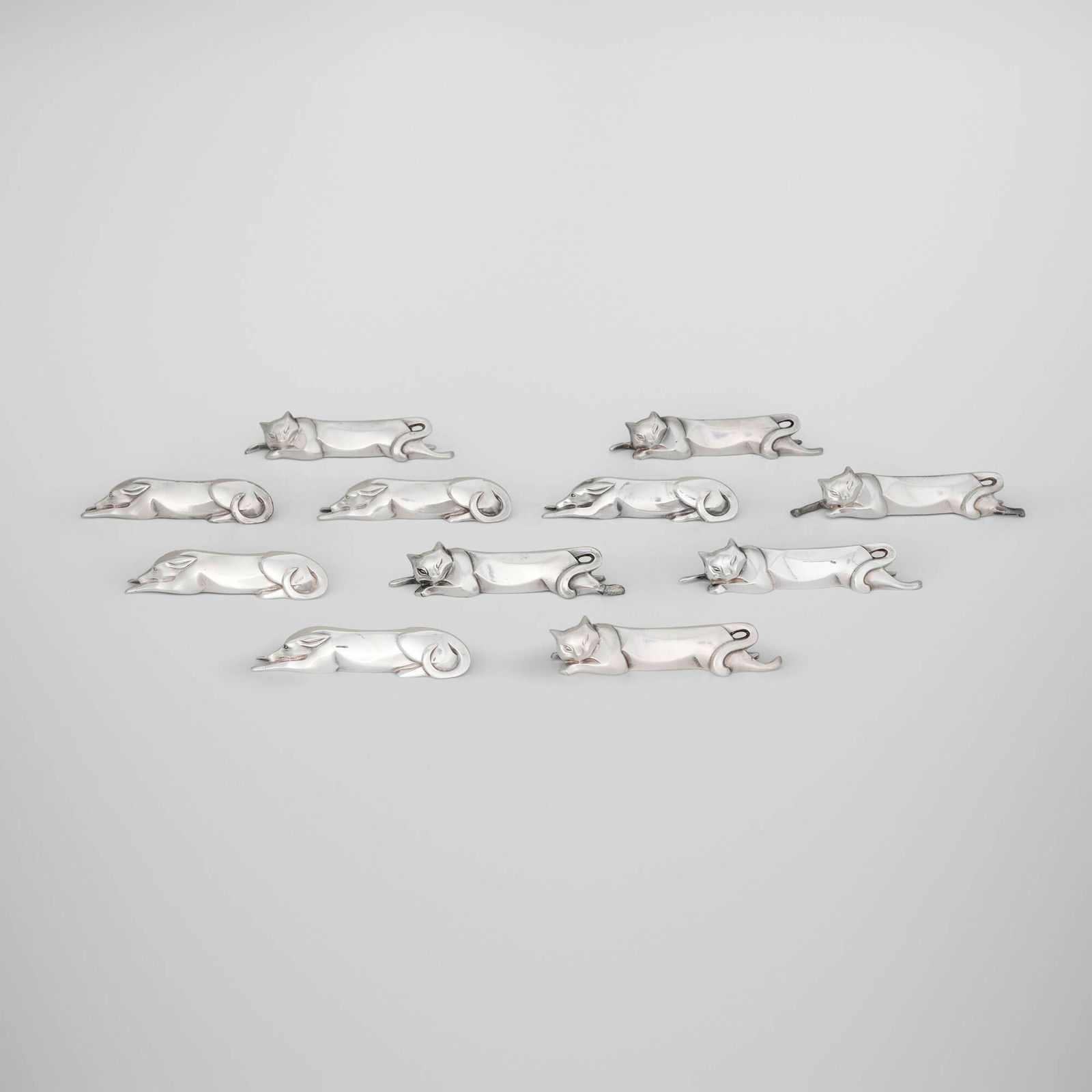 Edouard-Marcel Sandoz, Gallia animalier knife rests, set of eleven: Edouard-Marcel Sandoz Gallia animalier knife rests, set of eleven ChristofleSwitzerland / France, c. 1930silver-plated metal 0.875 h x 4.25 w x 0.75 d in (2 x 11 x 2 cm) 0.75 h x 3.625 w x 0