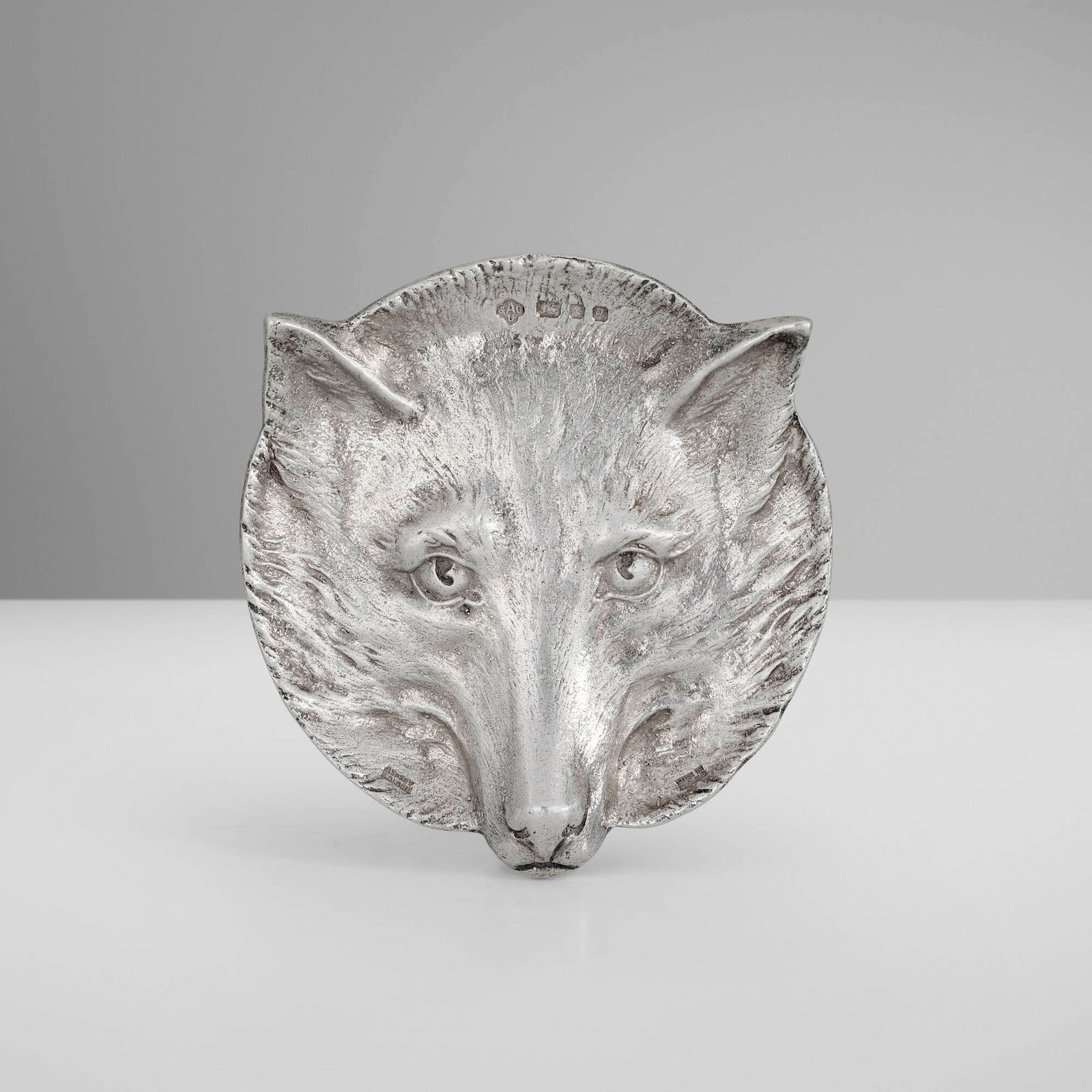Asprey & Co., Elizabeth II fox head dish: Asprey & Co. Elizabeth II fox head dish United Kingdom, 1971silver 0.5 h x 4 dia in (1 x 10 cm) Impressed manufacturer's mark, maker's mark and English hallmarks to dish 'Asprey London Made in