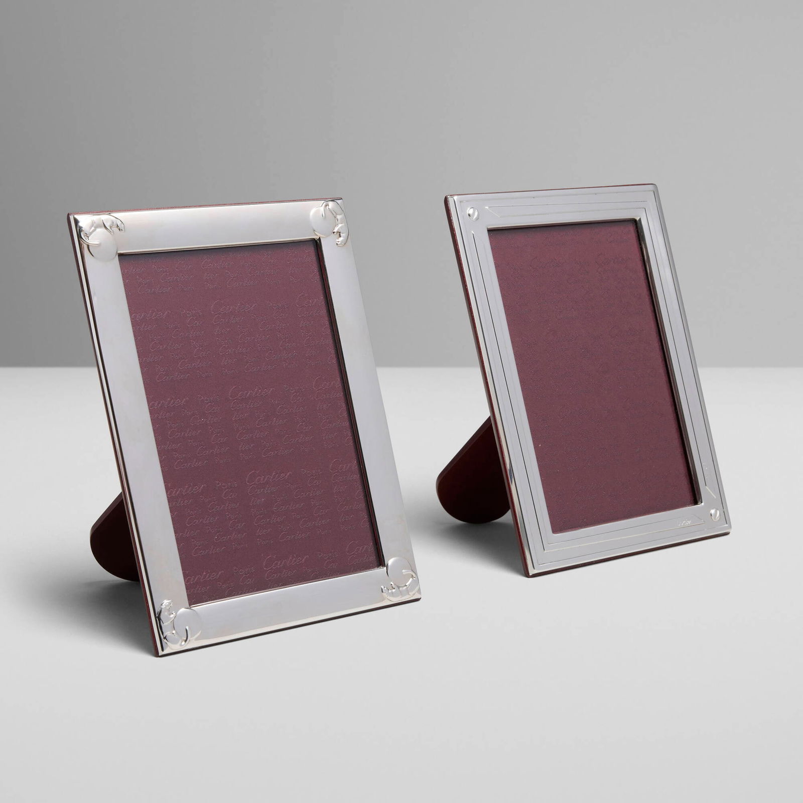Cartier, Picture frames, set of two: Cartier Picture frames, set of two France, c. 2000sterling silver, rosewood, glass, fabric 7.25 h x 5.25 w x 1 d in (18 x 13 x 3 cm) Frames feature Panthere and Santos designs. I