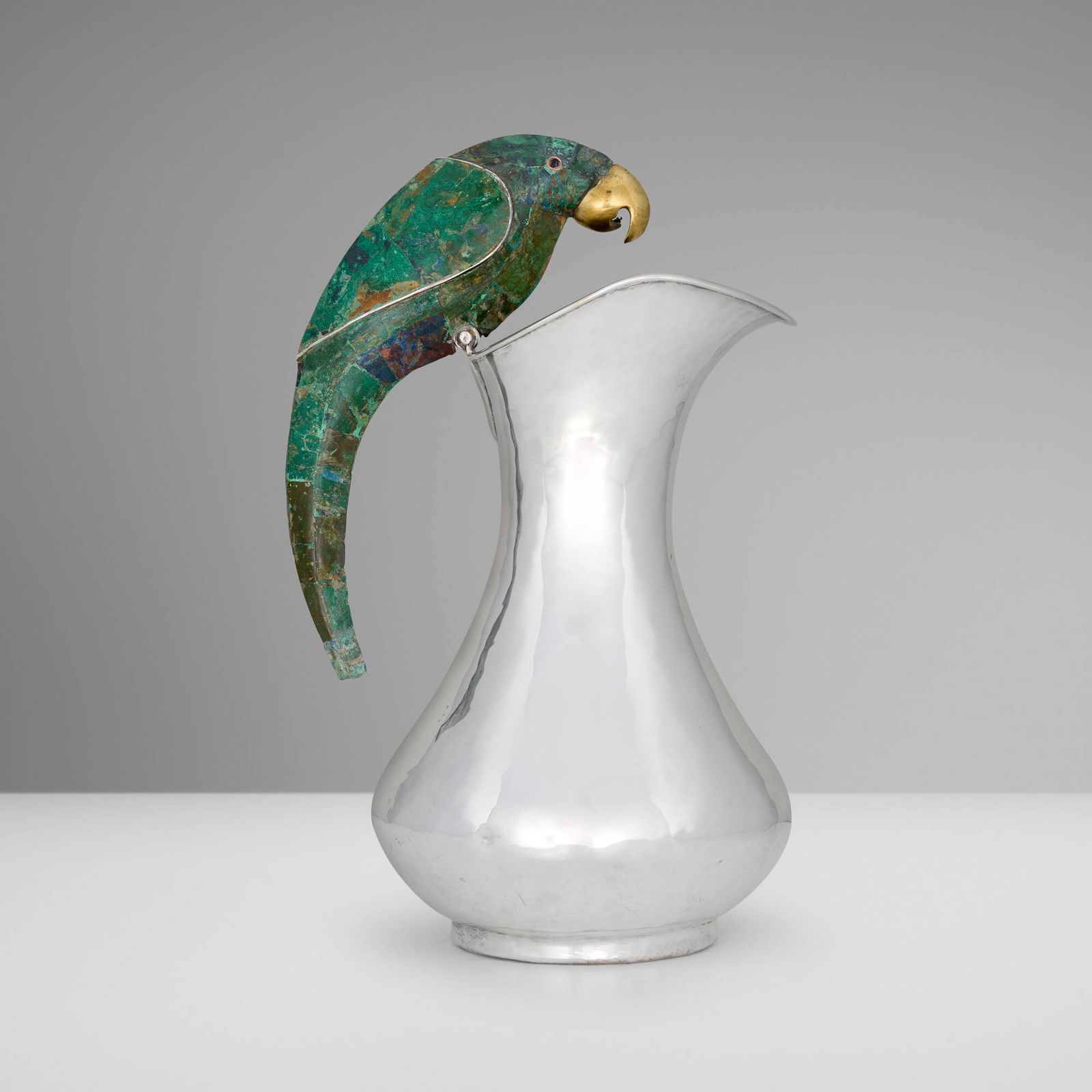 Los Castillo, Tall pitcher with parrot handle: Los Castillo Tall pitcher with parrot handle Mexico, c. 1940silver-plated metal, hardstone, copper, brass 13.75 h x 7 w x 7 d in (35 x 18 x 18 cm) Impressed manufacturer's mark to underside '3