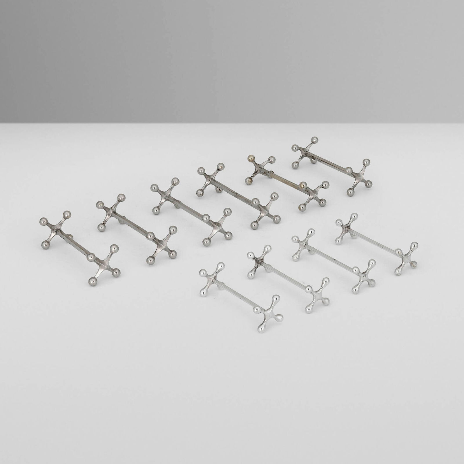 European, Knife rests, set of ten: European Knife rests, set of ten first half of the 20th century silver-plated brass largest: 1.25 h x 3.5 w x 1.25 d in (3 x 9 x 3 cm) smallest: 1 h x 3 w x 1 d in (3 x 8 x 3 cm) Provenance: