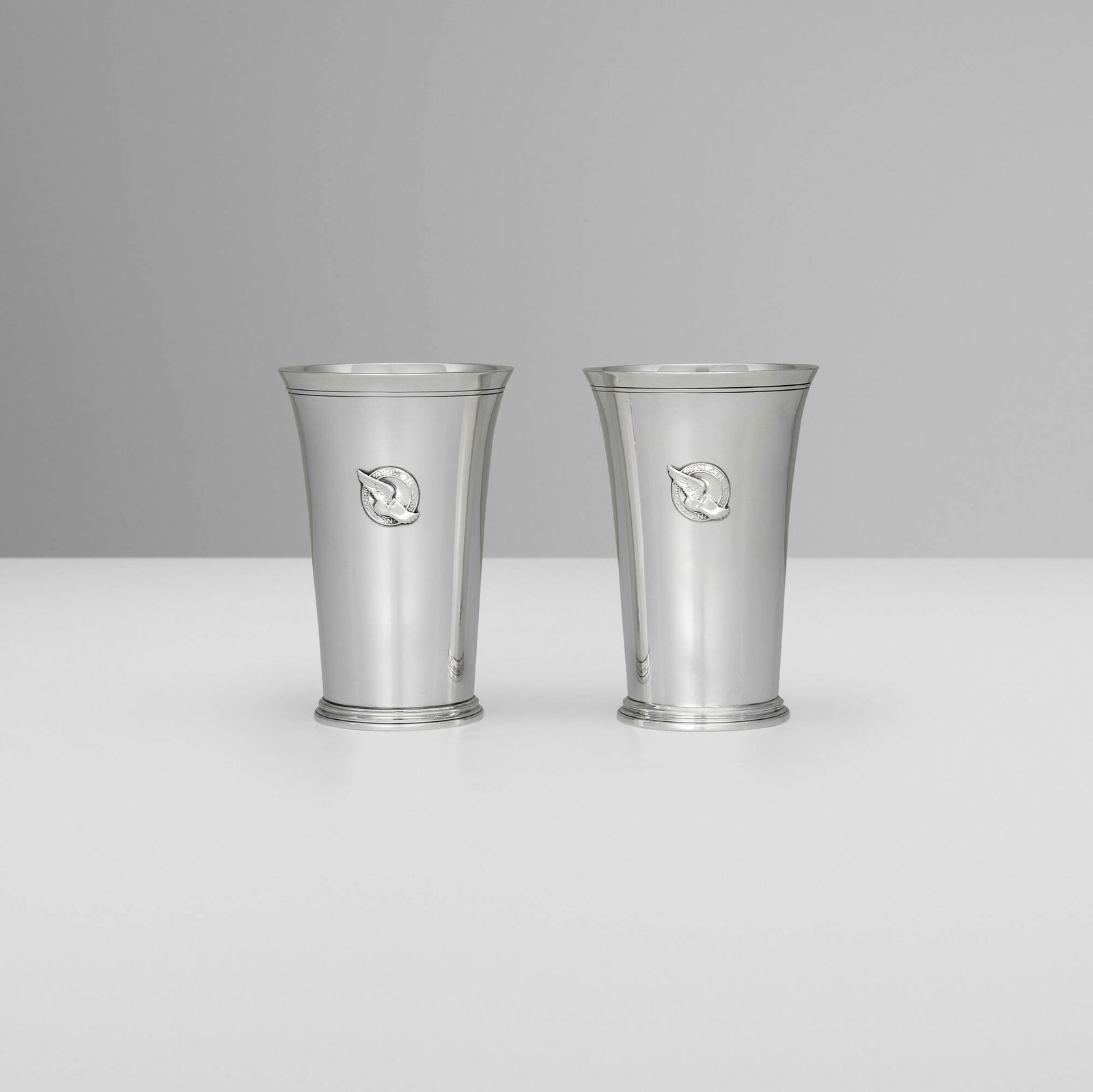 Tiffany & Co., New York Athletic Club presentation tumblers, set of two: Tiffany & Co. New York Athletic Club presentation tumblers, set of two New York, USA, c. 1937-38 sterling silver 5 h x 3.25 dia in (13 x 8 cm) Impressed manufacturer's mark to underside of each