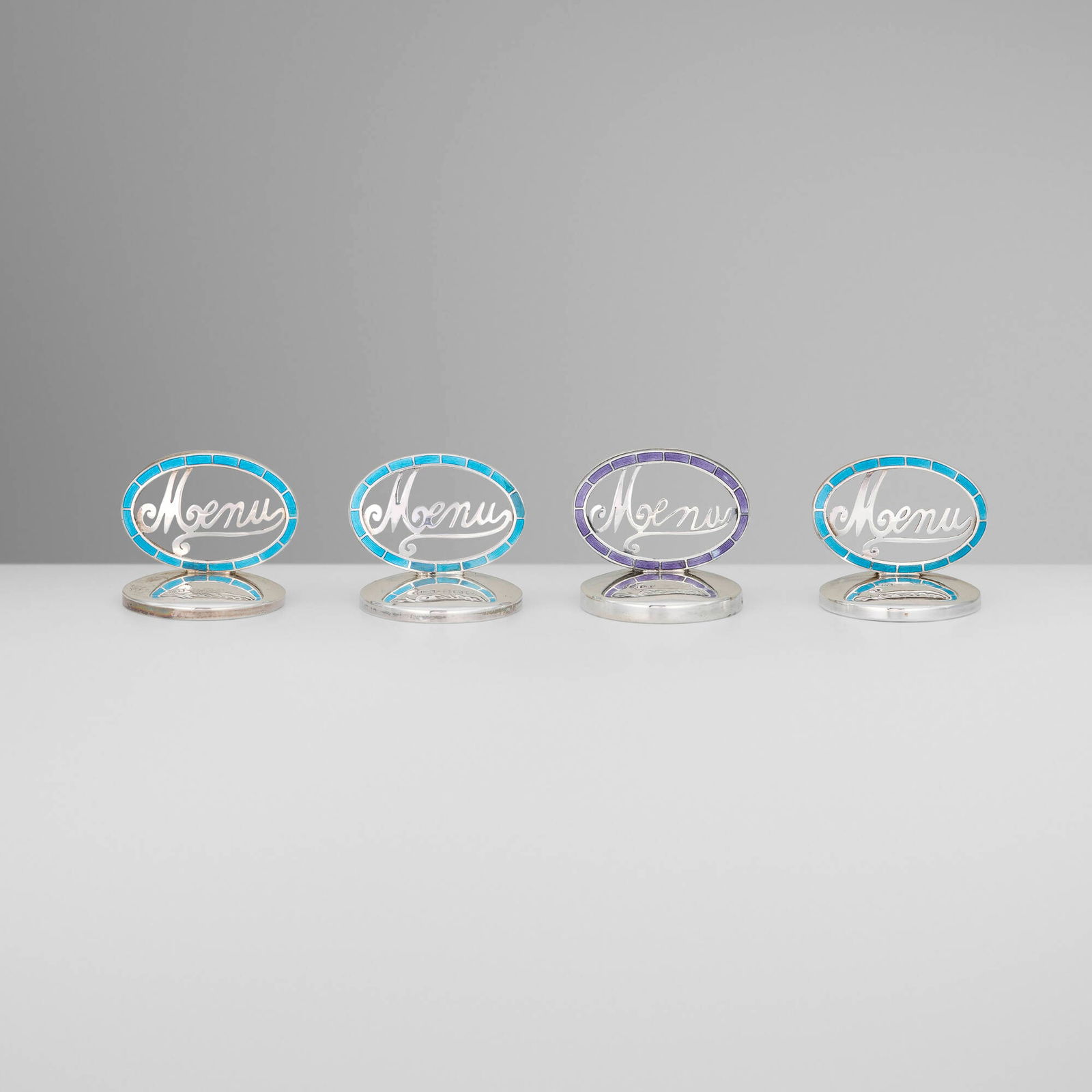 Levi & Salaman, Edwardian menu holders, set of four: Levi & Salaman Edwardian menu holders, set of four Birmingham, United Kingdom, 1910silver, enamel 1.5 h x 1.5 dia in (4 x 4 cm) Impressed maker's mark and English hallmarks to base of each exa