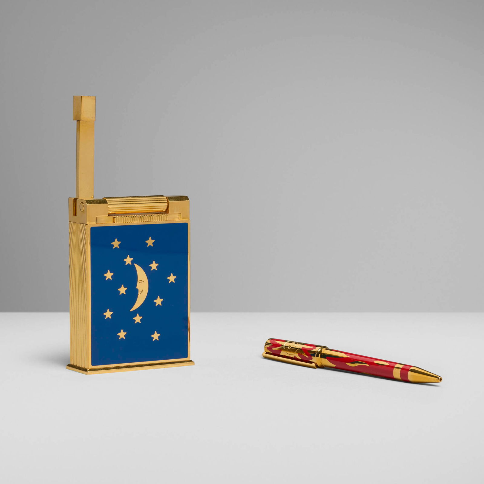 S.T. Dupont, Rendez-Vous jeroboam table lighter and ball pen: S.T. Dupont Rendez-Vous jeroboam table lighter and ball pen France, 1996silver-plated metal, gold-plated metal, lacquer pen: 5.25 h x 0.625 w x 0.5 d in (13 x 2 x 1 cm) table lighter: 4 h x 2.75 w