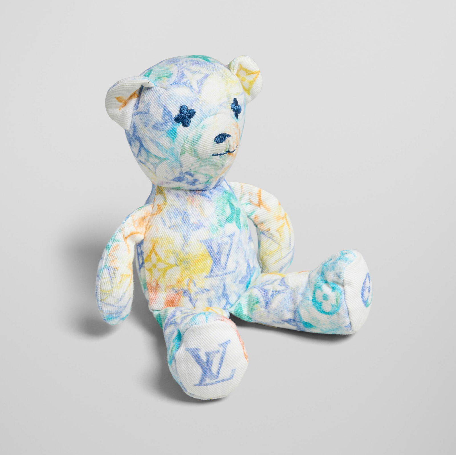 Louis Vuitton X UNICEF, Blue Watercolor Doudou Louis teddy bear: Louis Vuitton X UNICEF Blue Watercolor Doudou Louis teddy bear 2021 printed fabric with embroidered monogram eyes, cotton 9 h x 5.5 w x 3 d in (23 x 14 x 8 cm) Upholstery manufacturer label to