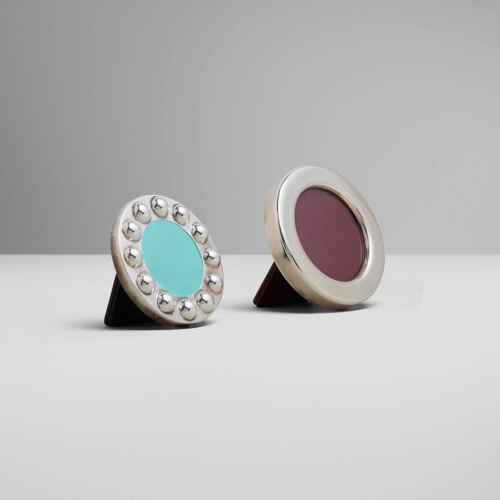 Paloma Picasso for Tiffany & Co. and Cartier, Picture frames, set of two: Paloma Picasso for Tiffany & Co. and Cartier Picture frames, set of two 1990, 2003 sterling silver, leather, fabric, glass 3.5 h x 3.5 w x 1.5 d in (9 x 9 x 4 cm) 3 h x 3 w x 1.5 d in (8 x 8 x 4