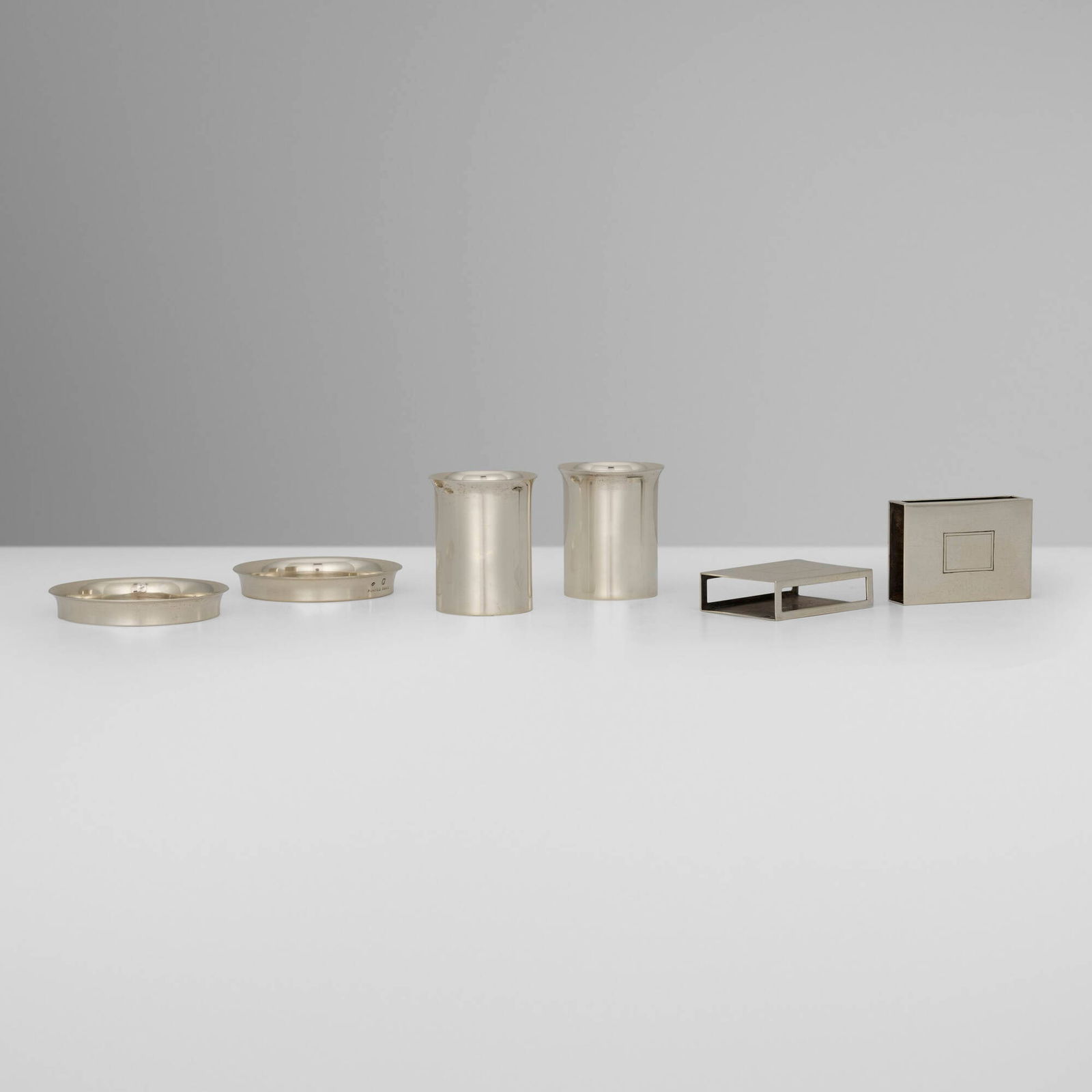 Hermes, Six-piece smoking set: Hermes Six-piece smoking set Ravinet d'Enfert & Cie France, c. 1965 .950 silver gilt cigarette holder: 2 h x 1.625 w in (5 x 4 cm) matchbox holder: 2 h x 1.5 w x 0.5 d in (5 x 4 x 1 cm) ashtray: