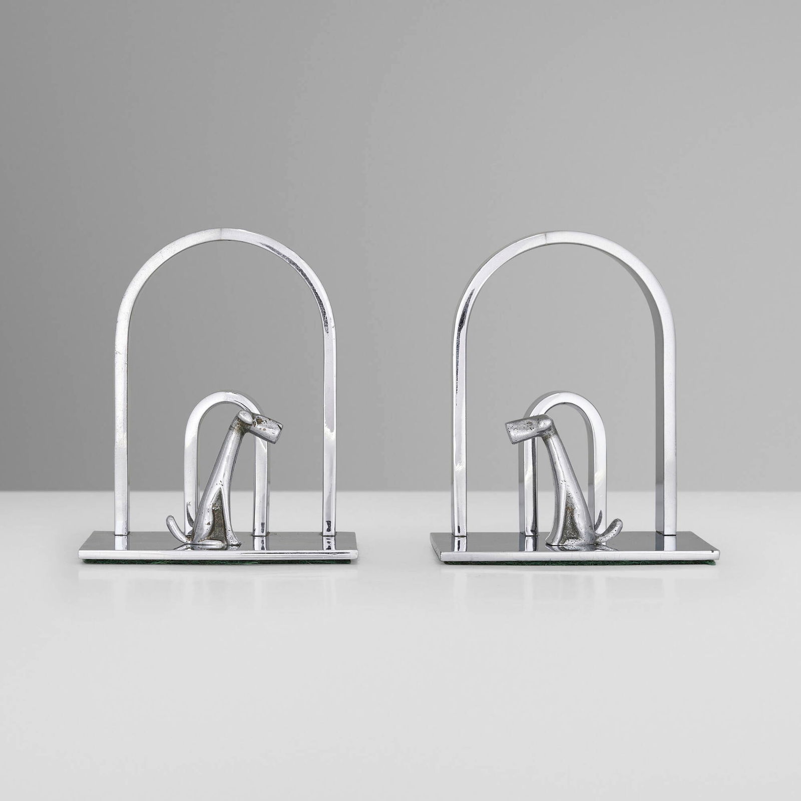 Mayfair Products, Bookends with fox terrier, pair: Mayfair Products Bookends with fox terrier, pair United Kingdom, c. 1935 chrome-plated metal 4.25 h x 3.5 w x 3 d in (11 x 9 x 8 cm) Impressed manufacturer's mark to reverse of each example