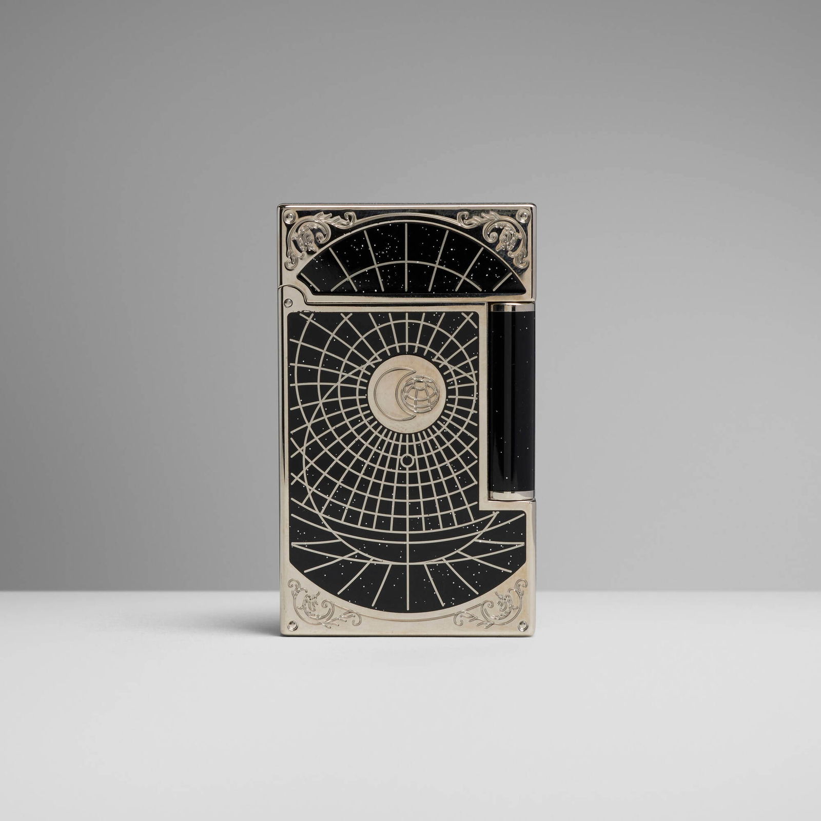 S.T. Dupont, Shoot the Moon Premium pocket lighter: S.T. Dupont Shoot the Moon Premium pocket lighter France, 2015 lacquer, chrome-plated metal, silver glitter 2.375 h x 1.5 w x 0.5 d in (6 x 4 x 1 cm) S.T. Dupont's Shoot the Moon series was