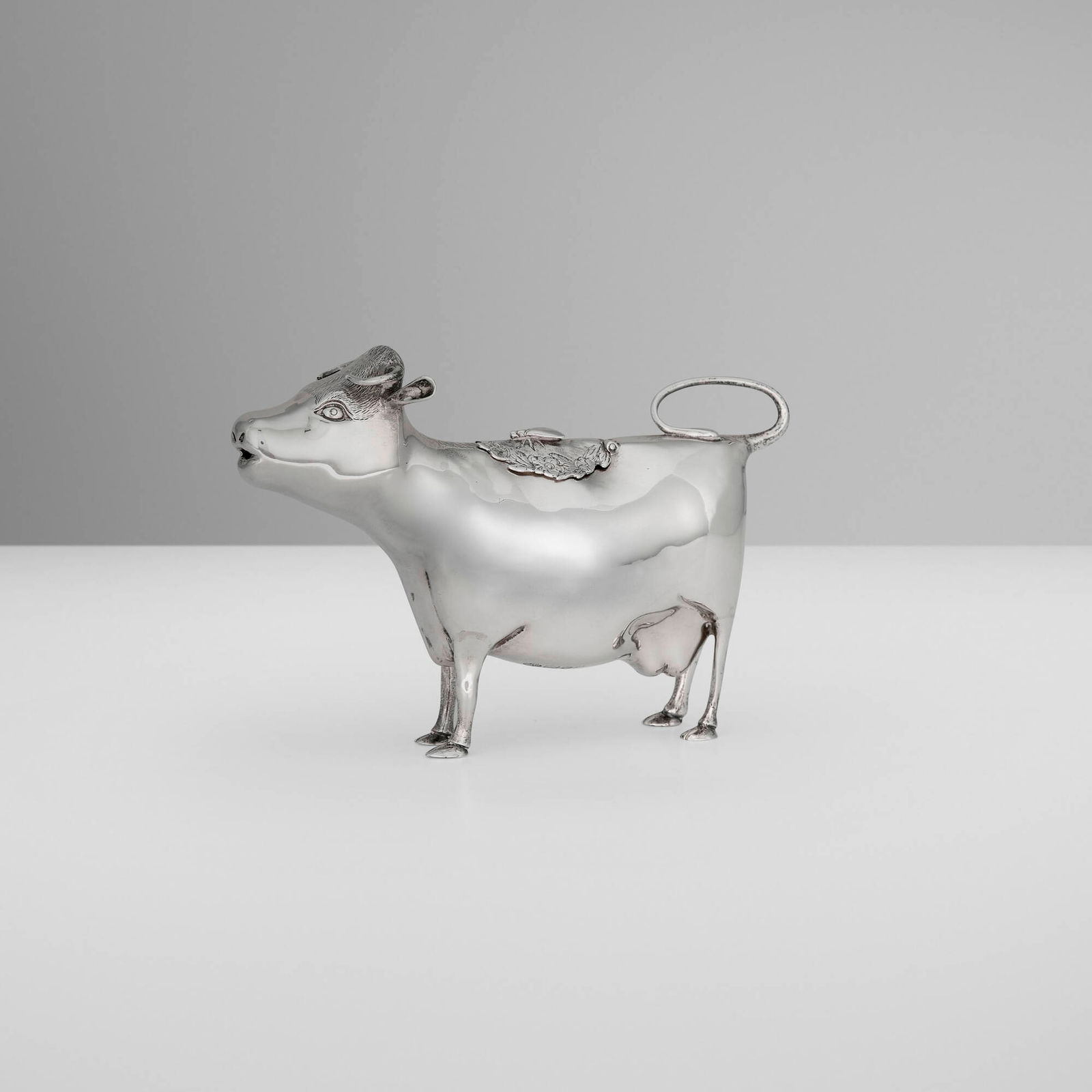 Asprey & Co., Elizabeth II novelty cow creamer: Asprey & Co. Elizabeth II novelty cow creamer United Kingdom, 1961 silver 4 h x 6 w x 2.25 d in (10 x 15 x 6 cm) Impressed maker's mark and English hallmarks to underside 'Asprey London'. 5.30