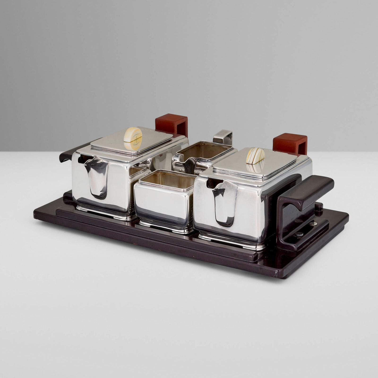Harold Stabler, George V Art Deco coffee and tea service: Harold Stabler George V Art Deco coffee and tea service Adie Brothers Ltd. Birmingham, United Kingdom, c. 1930 electroplated nickel silver, Bakelite, gutta-percha, bone 4 h x 12.5 w x 7.75 d in (10