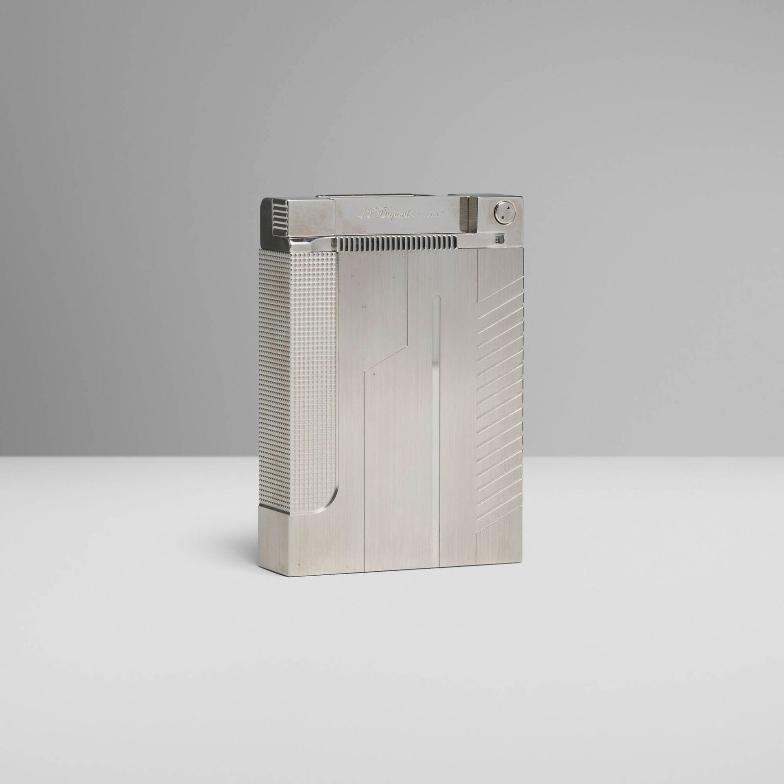 S.T. Dupont, James Bond 007 jeroboam table lighter: S.T. Dupont James Bond 007 jeroboam table lighter France, 2004 palladium-plated metal 4 h x 2.75 w x 0.875 d in (10 x 7 x 2 cm) Impressed manufacturer's mark and number '157/707 S.T. Dupont Paris