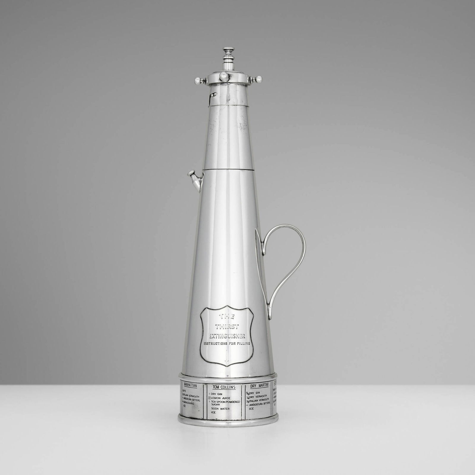 Asprey & Co., The Thirst Extinguisher cocktail shaker: Asprey & Co. The Thirst Extinguisher cocktail shaker London, United Kingdom, c. 1932 silver-plated metal 15 h x 5 dia in (38 x 13 cm) Cocktail shaker features eight different cocktail recipes to