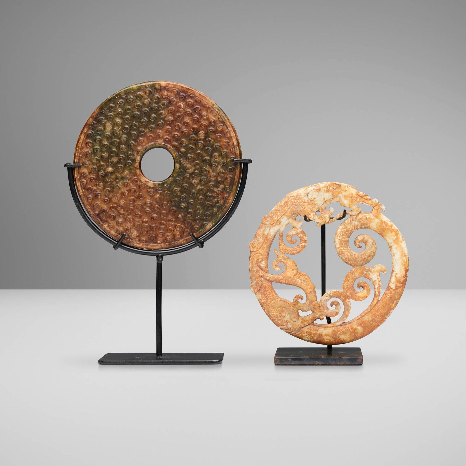 Chinese, Bi discs, set of two: Chinese Bi discs, set of two Archaistic style, modern jade 0.25 d x 6 dia in (1 x 15 cm) 0.25 d x 5.5 dia in (1 x 14 cm) Set includes one dragon example. This work will ship from Lambertville,