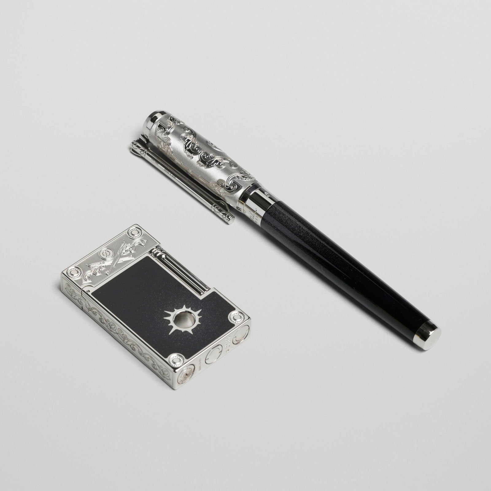 S.T. Dupont, Conquest of the Wild West pocket lighter and rollerball pen: S.T. Dupont Conquest of the Wild West pocket lighter and rollerball pen France, 2017 lacquer, palladium-plated metal pen: 5.75 h x 0.875 w x 0.625 d in (15 x 2 x 2 cm) lighter: 2.5 h x 1.5 w x