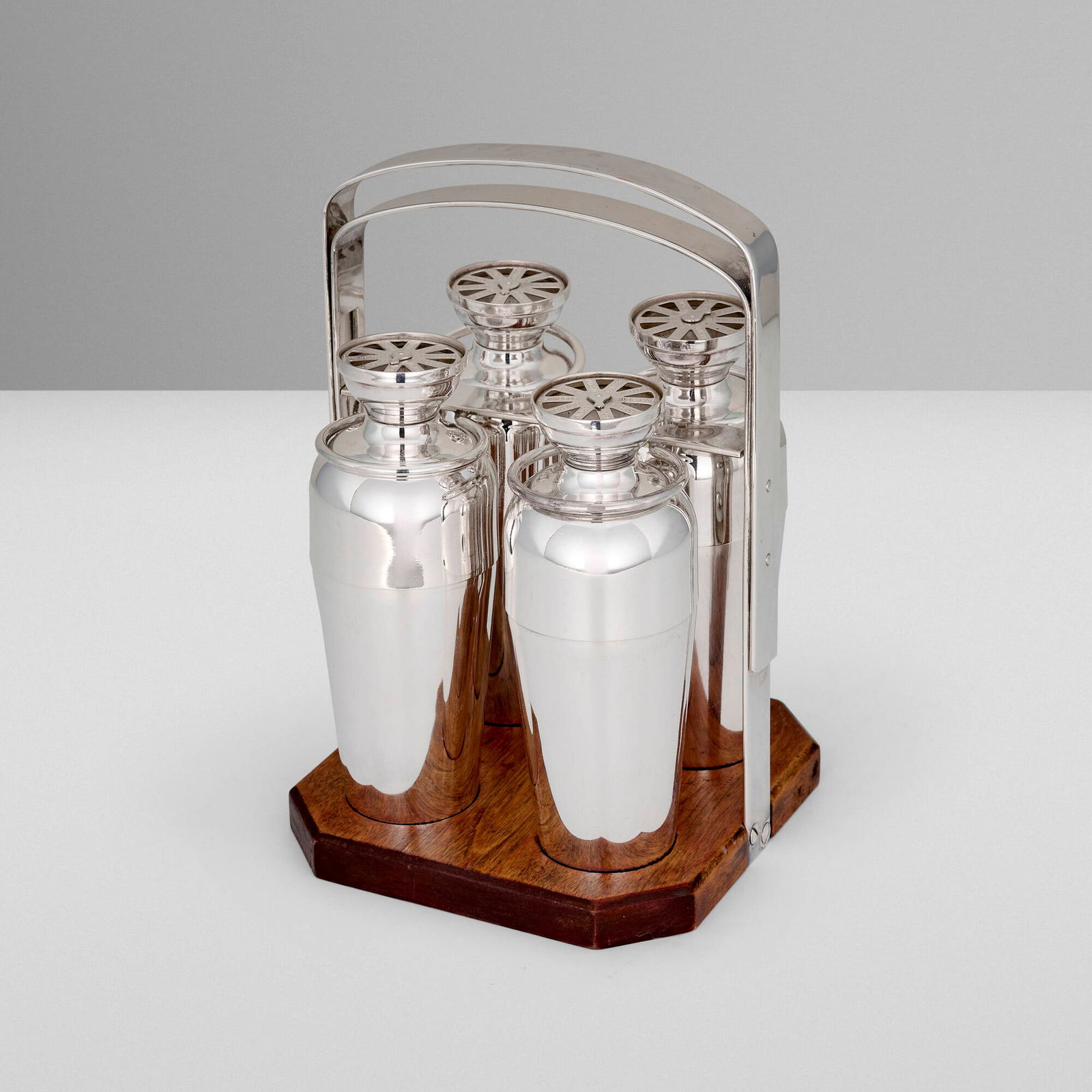 Napier Company, Foursome cocktail shaker set: Napier Company Foursome cocktail shaker set USA, c. 1934 silver-plated metal, wood stand: 8.75 h x 6 w x 6 d in (22 x 15 x 15 cm) shaker: 6.25 h x 2.5 dia in (16 x 6 cm) Impressed manufacturer's