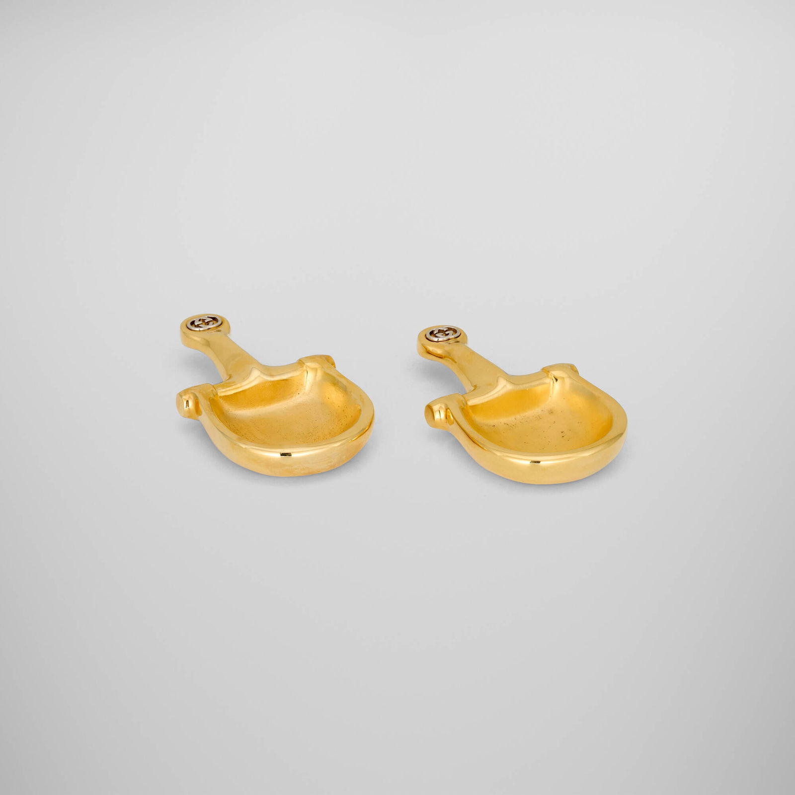 Gucci, Horse Bit trinket trays, pair: Gucci Horse Bit trinket trays, pair Italy, c. 1975 gilt metal 1 h x 3.375 w x 6 d in (3 x 9 x 15 cm) Impressed manufacturer's mark to underside of each example 'Made in Italy by Gucci'. This