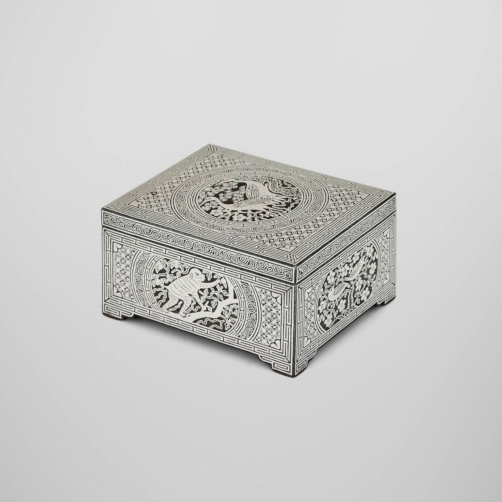 Korean, Auspicious Animals covered box: Korean Auspicious Animals covered box 19th century silver inlay over steel 2.5 h x 4.5 w x 3.625 d in (6 x 11 x 9 cm) This work will ship from Chicago, Illinois.