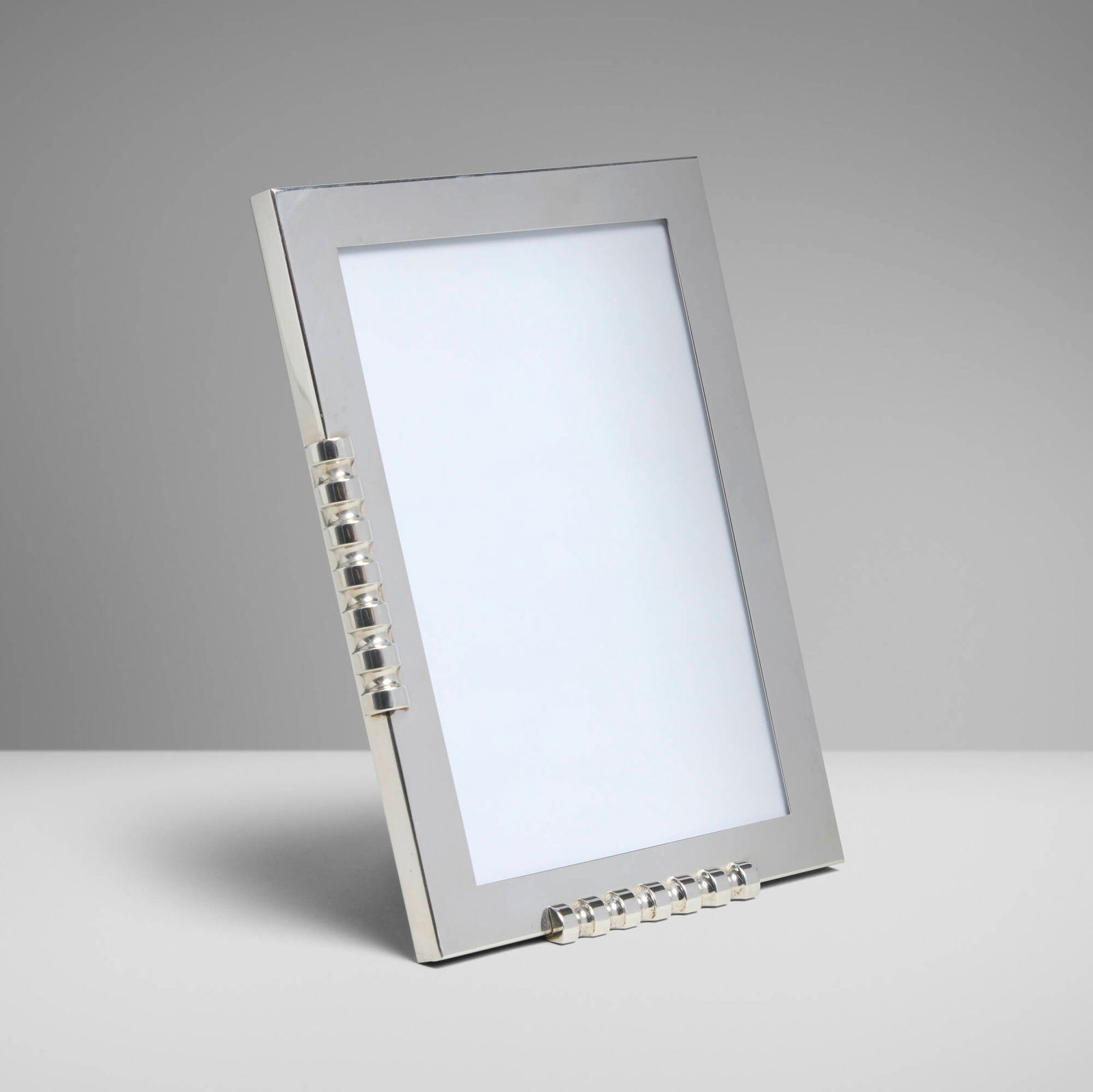 Paloma Picasso for Tiffany & Co., Picture frame: Paloma Picasso for Tiffany & Co. Picture frame Spain, 2003 sterling silver, leather, glass 7.25 h x 5.25 w x 1 d in (18 x 13 x 3 cm) Impressed manufacturer's mark to underside edge '? Paloma