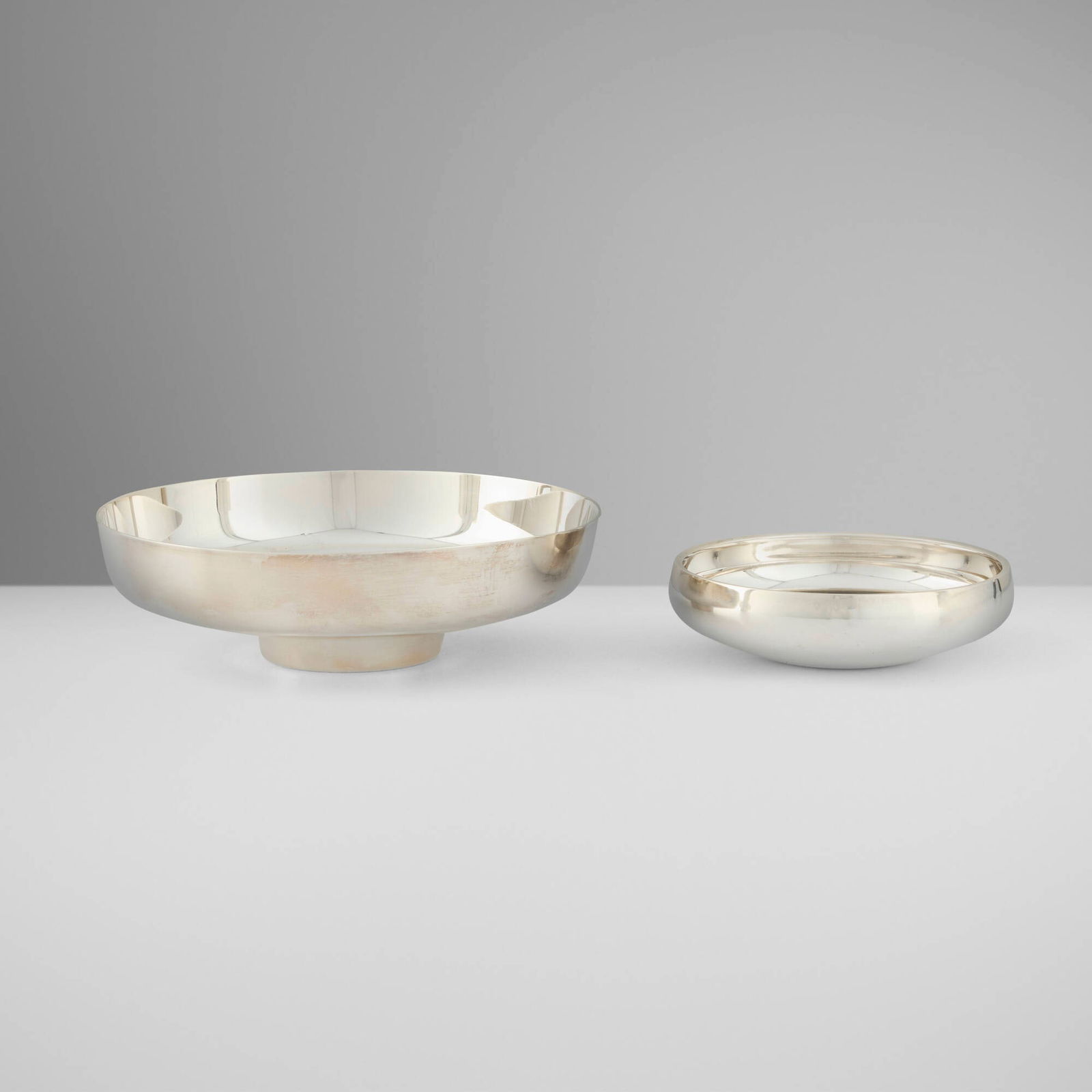 Henning Koppel, Bowls, set of two: Henning Koppel Bowls, set of two Georg JensenDenmark, 1965sterling silver 2 h x 6.5 dia in (5 x 17 cm) 1.25 h x 4.5 dia in (3 x 11 cm) Set is comprised of models 1132B and 1131. Impre