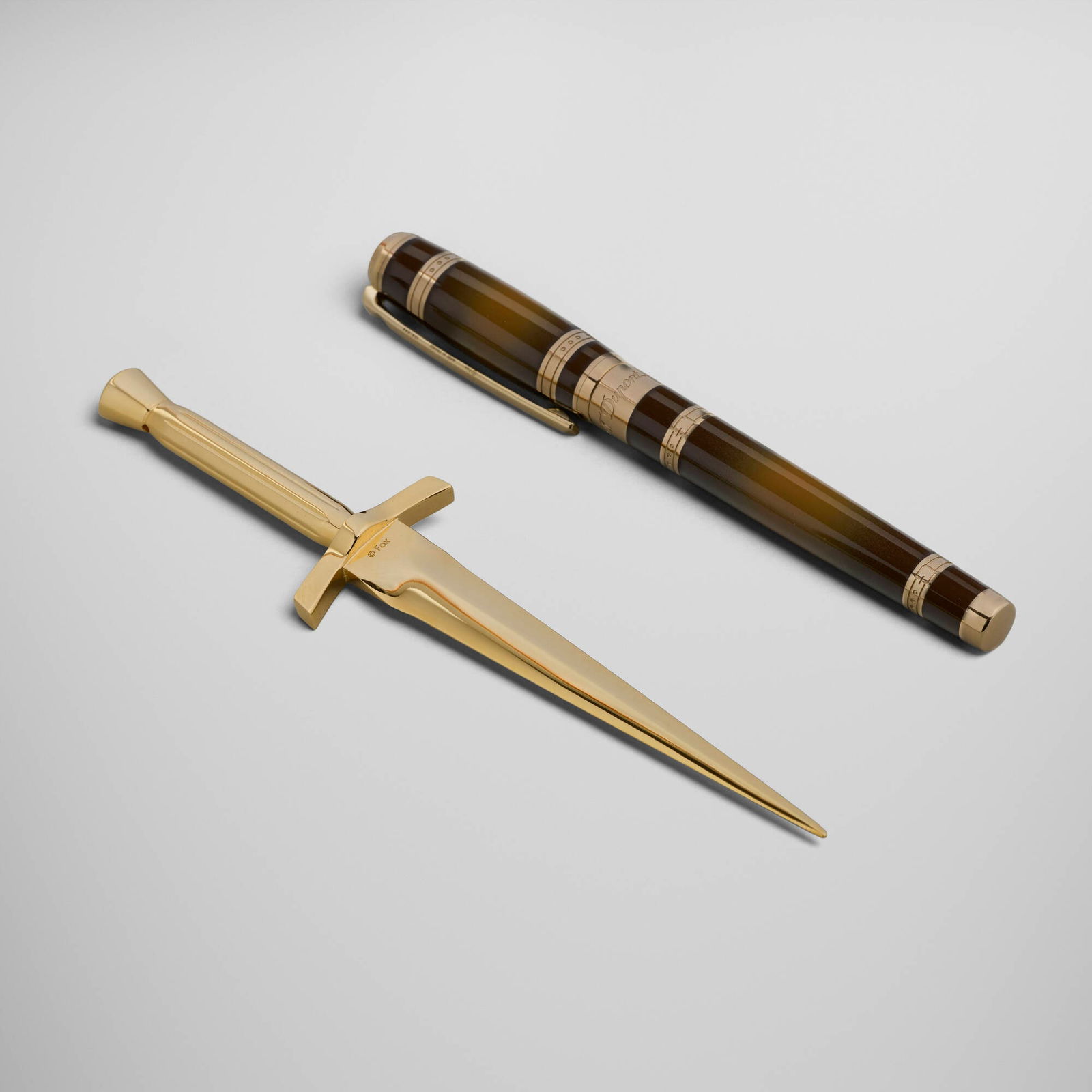 S.T. Dupont, Murder on the Orient Express ball pen and letter opener set: S.T. Dupont Murder on the Orient Express ball pen and letter opener set France, 2017lacquer, gold-plated metal pen: 5.375 h x 0.75 w x 0.625 d in (14 x 2 x 2 cm) letter opener: 6.625 h x 1.375 w x