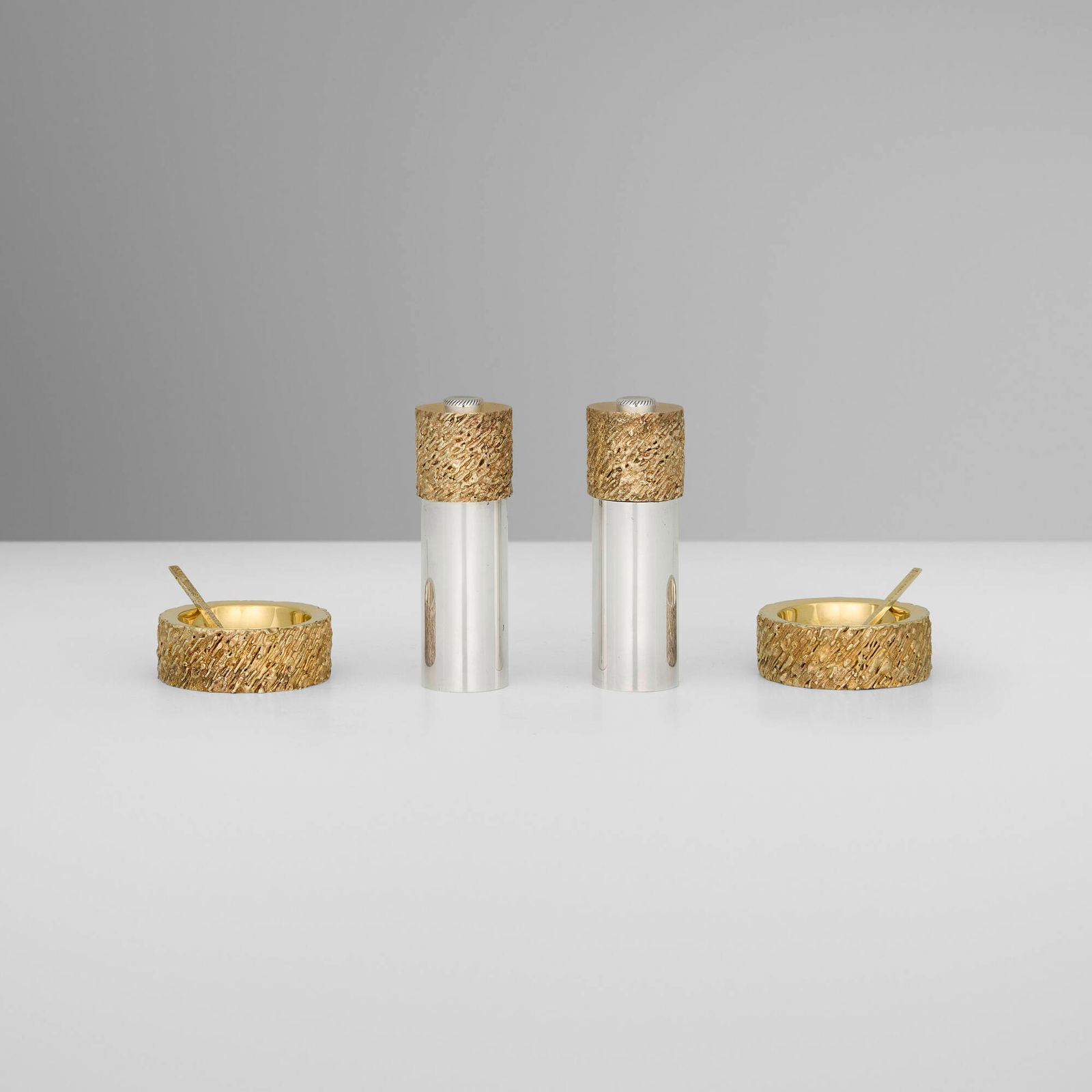 Stuart Devlin for Cartier, Elizabeth II salt and pepper set: Stuart Devlin for Cartier Elizabeth II salt and pepper set London, United Kingdom, 1969silver parcel-gilt largest: 3.25 h x 1.25 dia in (8 x 3 cm) smallest: 2 h x 0.5 w x 0.5 d in (5 x 1 x 1 cm)