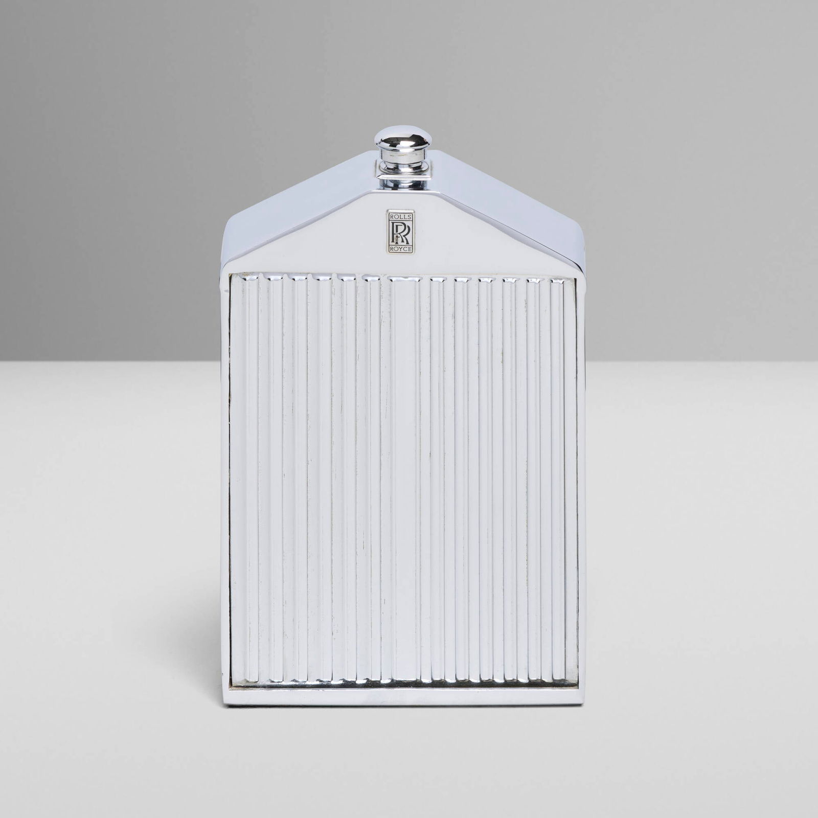 Ruddspeed Ltd., Rolls-Royce radiator grille decanter: Ruddspeed Ltd. Rolls-Royce radiator grille decanter United Kingdom, c. 1965chrome-plated metal, glass liner 7.75 h x 4.75 w x 1.75 d in (20 x 12 x 4 cm) Impressed manufacturer's mark to revers