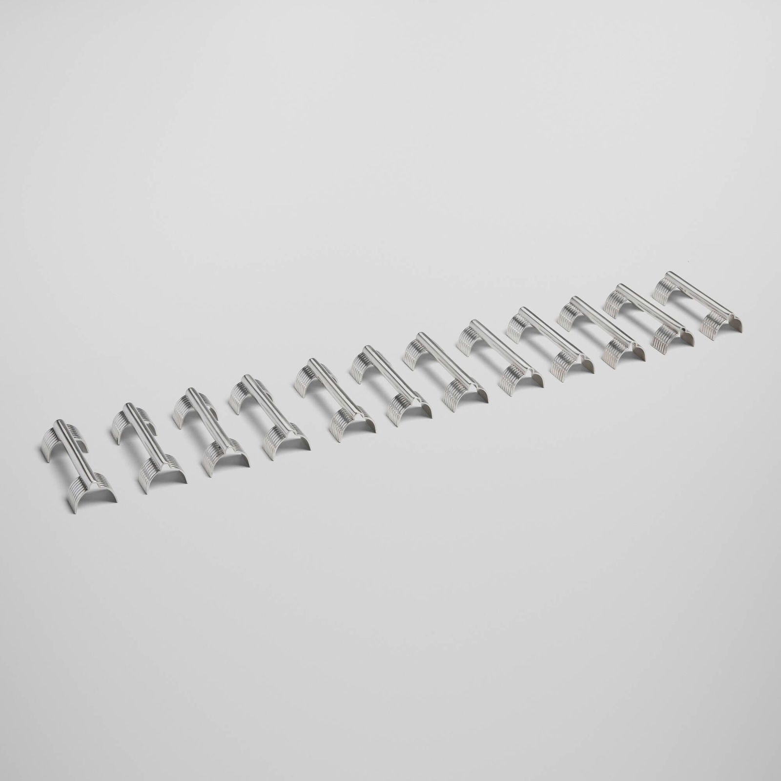 Christofle, Knife rests, set of twelve: Christofle Knife rests, set of twelve France, c. 1950silver-plated metal 1 h x 3.5 w x 1 d in (3 x 9 x 3 cm) Impressed maker's marks to reverse of each example 'Christofle'. Sold with original