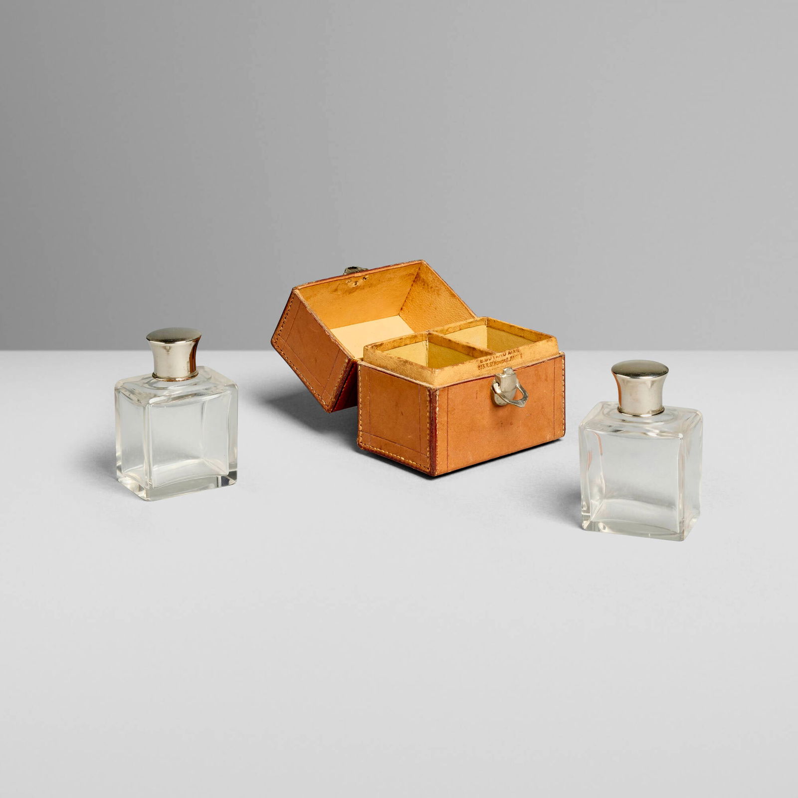 Goyard, Travel case with two cologne bottles: Goyard Travel case with two cologne bottles France, c. 1900leather, glass, silver-plated brass bottle (each): 3.75 h x 2.75 w x 1.75 d in (10 x 7 x 4 cm) case: 4 h x 4 w x 2.5 d in (10 x 10 x 6 cm