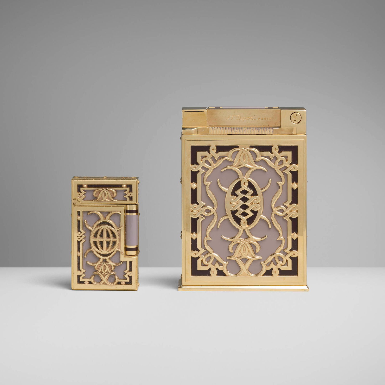S.T. Dupont, New York Fifth Avenue jeroboam table lighter and pocket lighter: S.T. Dupont New York Fifth Avenue jeroboam table lighter and pocket lighter France, 2007 lacquer, gilt metal pocket lighter: 2.375 h x 1.5 w x 0.5 d in (6 x 4 x 1 cm) table lighter: 4 h x 2.75 w x