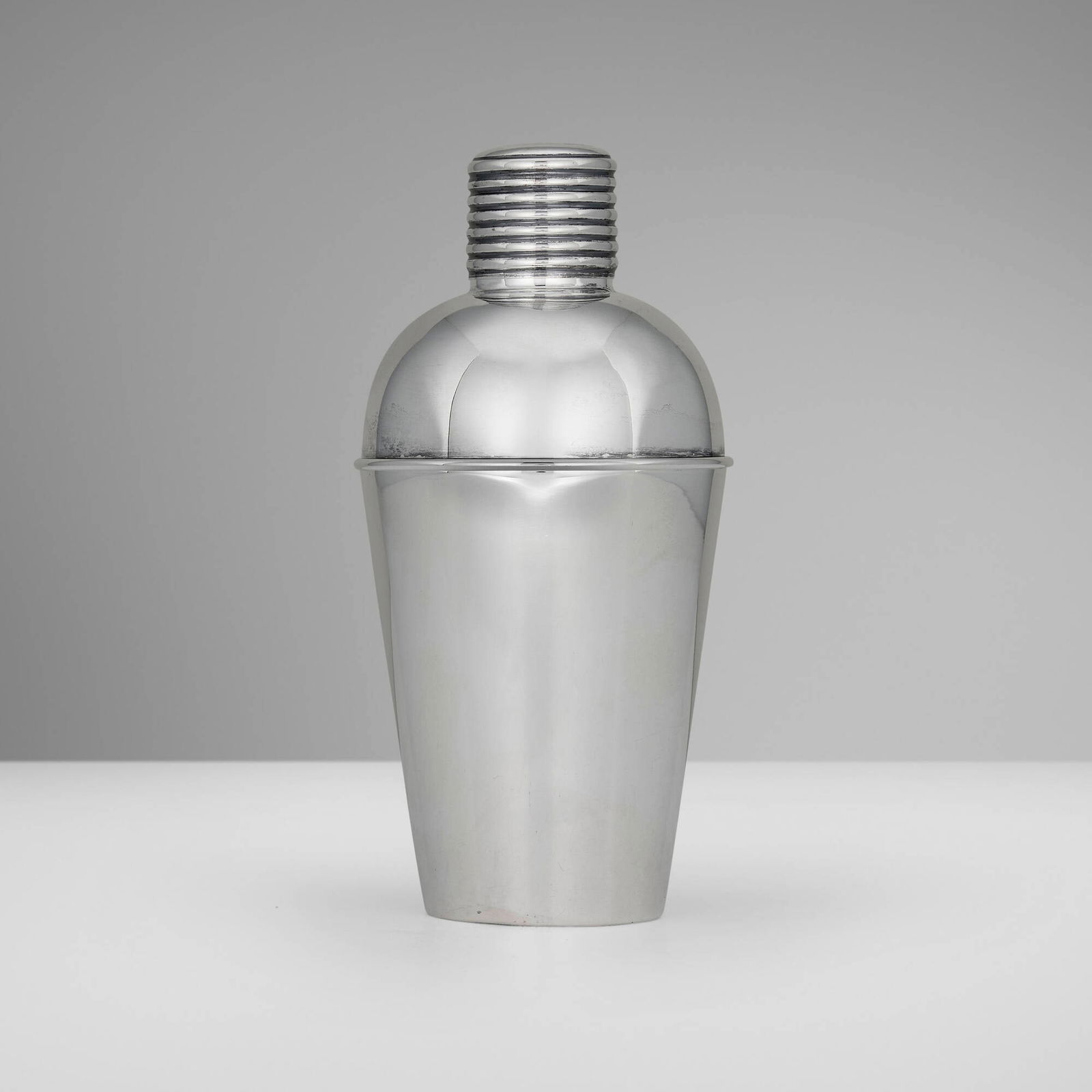 Gebruder Deyhle, Art Deco cocktail shaker: Gebruder Deyhle Art Deco cocktail shaker Germany, c. 1930.830 silver, cork 8 h x 3.75 dia in (20 x 10 cm) Impressed maker's mark with German hallmarks to underside '830S'. 11.27 ozt. (gross we