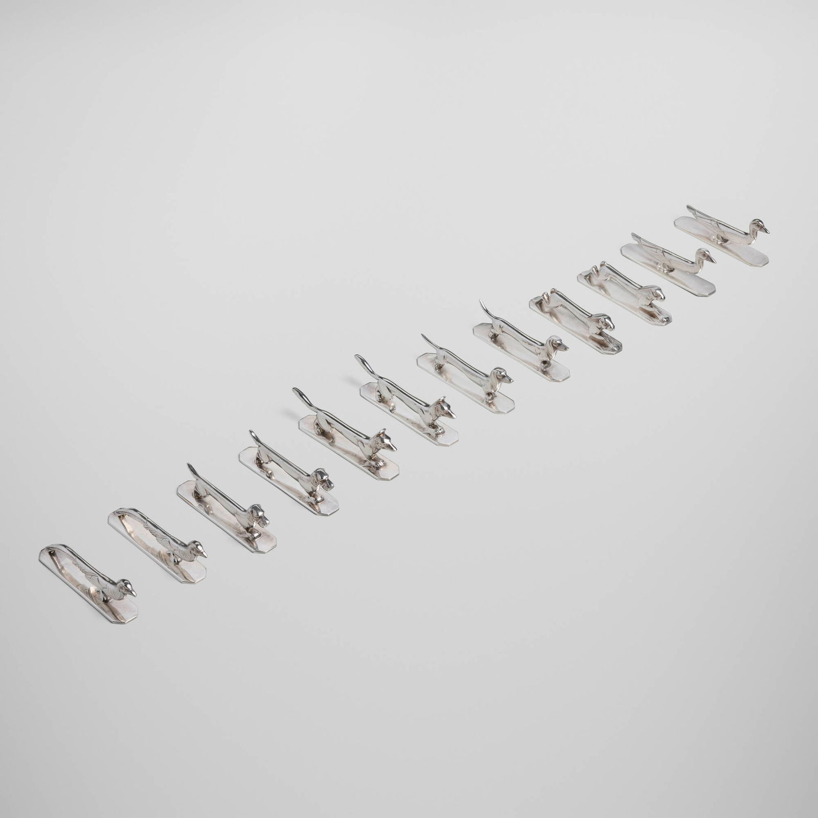 S.F.A.M., Animalier knife rests, set of twelve: S.F.A.M. Animalier knife rests, set of twelve France, c. 1930 silver-plated metal 1.5 h x 3.75 w x 0.75 d in (4 x 10 x 2 cm) Set is comprised of two rabbits, two foxes, two pheasants, two ducks,