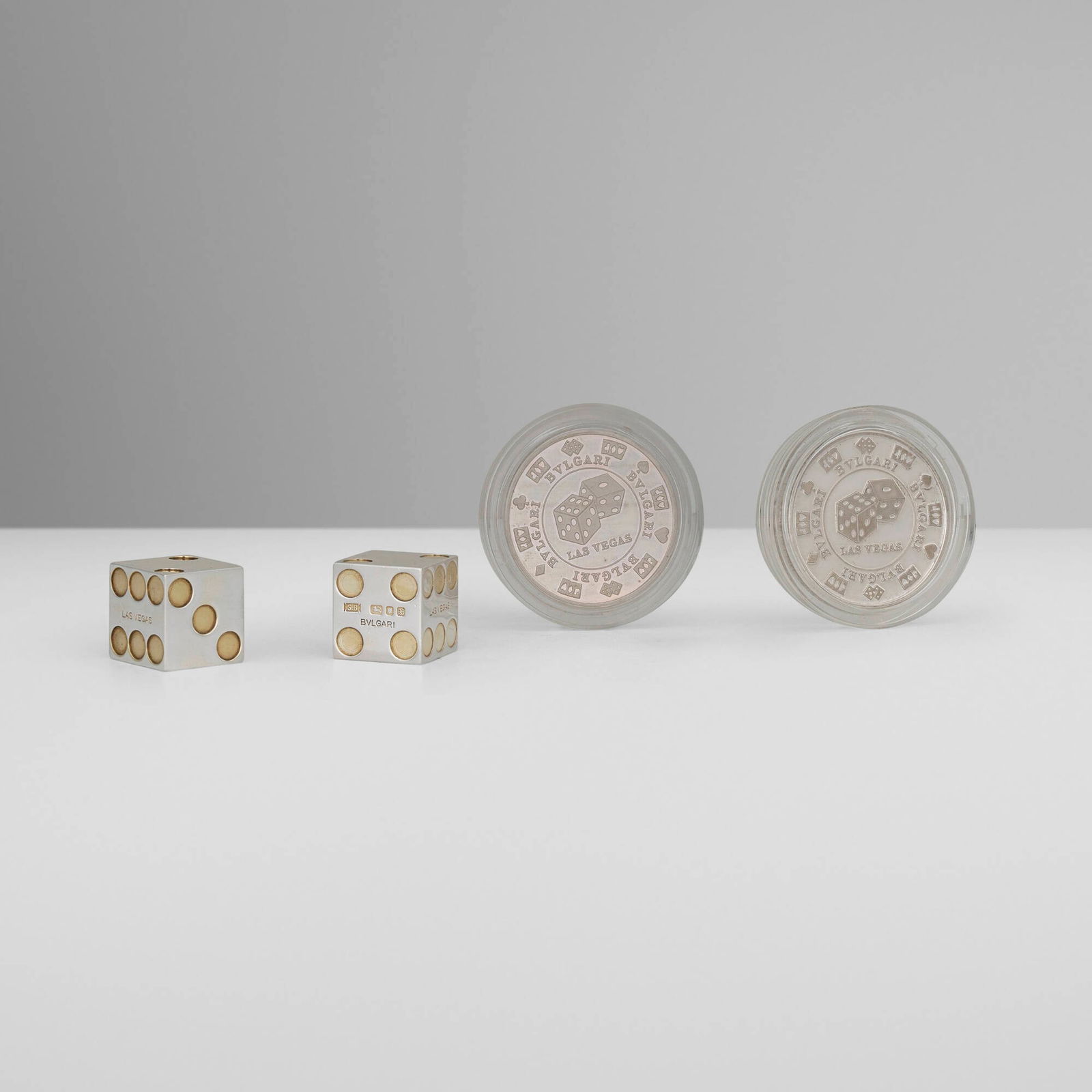 Bulgari, Collection of four works: Bulgari Collection of four works Italy / London, United Kingdom, 1982, 1996, 2001 sterling silver, sterling silver parcel-gilt chip: 0.25 h x 1.5 dia in (1 x 4 cm) die: 0.75 h x 0.75 w x 0.75 d in