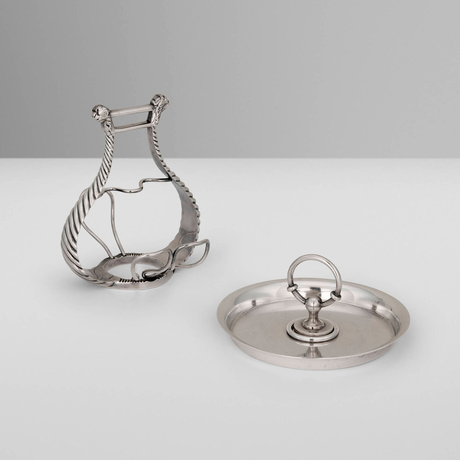 Hermes, Smoking accessories, set of two: Hermes Smoking accessories, set of two Ravinet d'Enfert & Cie France, c. 1965 silver-plated metal 6 h x 5 w x 5.25 d in (15 x 13 x 13 cm) 3 h x 5.75 dia in (8 x 15 cm) Set is comprised of a