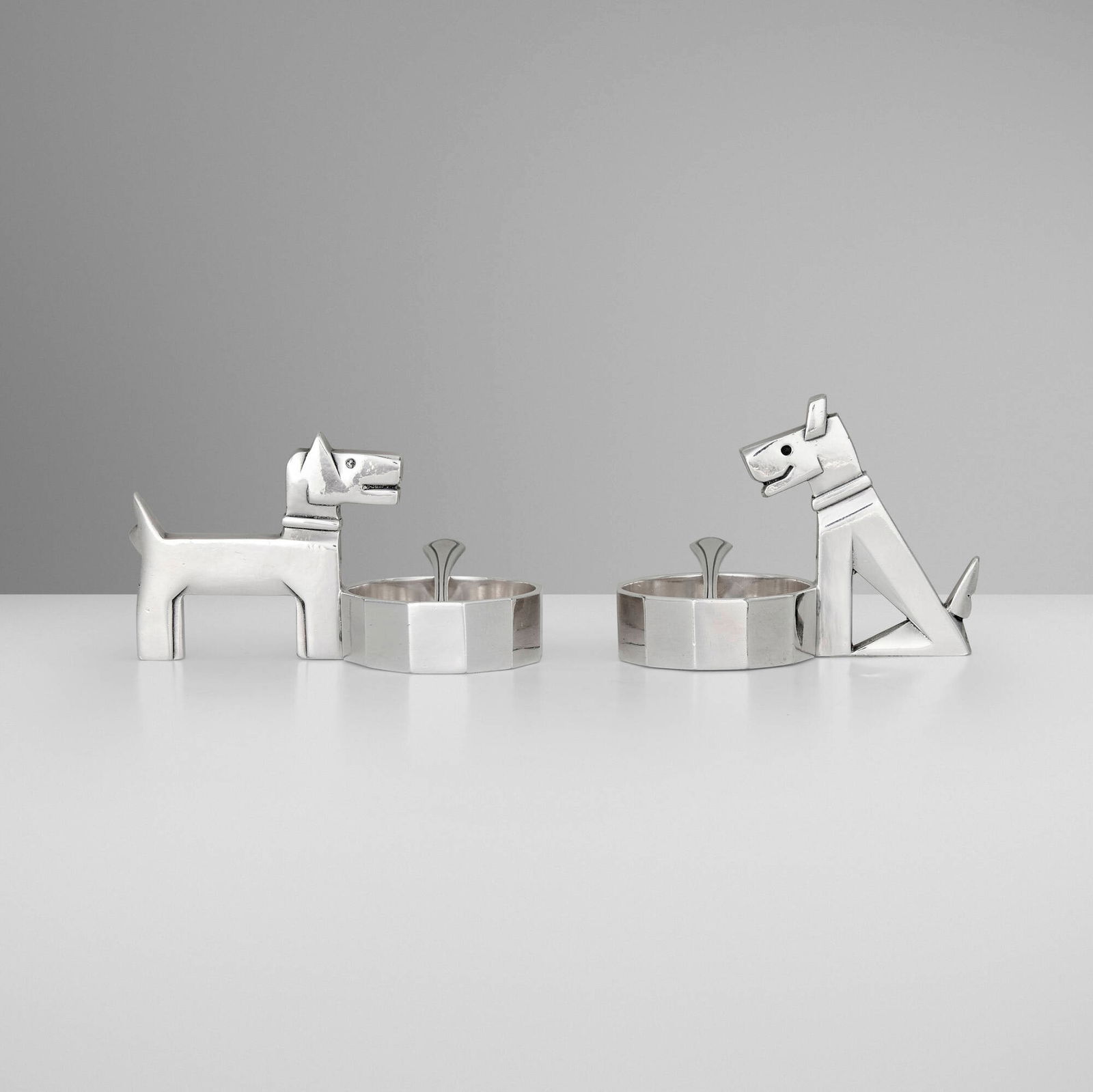 After Pol Rab, Gallia Ric & Rac salt cellars with spoons, pair: After Pol Rab Gallia Ric & Rac salt cellars with spoons, pair ChristofleFrance c. 1925silver-plated metal 2 h x 3.5 w x 1.75 d in (5 x 9 x 4 cm) 2.5 h x 0.5 w x 0.25 d in (6 x 1 x 1 cm) <