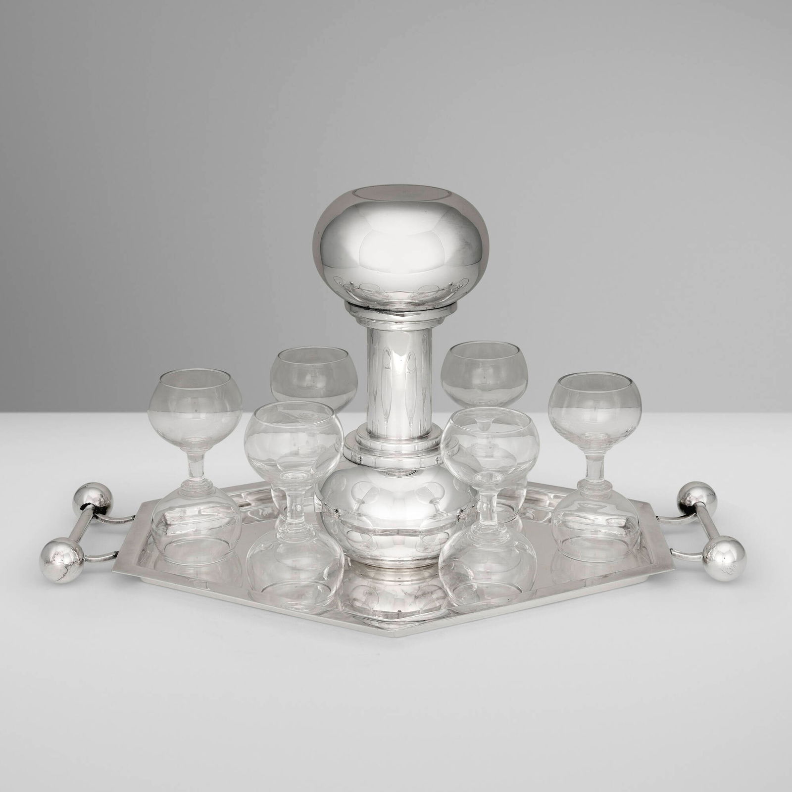 Asprey & Co., Dumbbell cocktail service: Asprey & Co. Dumbbell cocktail service London, United Kingdom, c. 1935 silver-plated metal, glass shaker: 10.5 h x 4.75 dia in (27 x 12 cm) glass: 5.125 h x 2.625 dia in (13 x 7 cm) tray: 1.25 h x