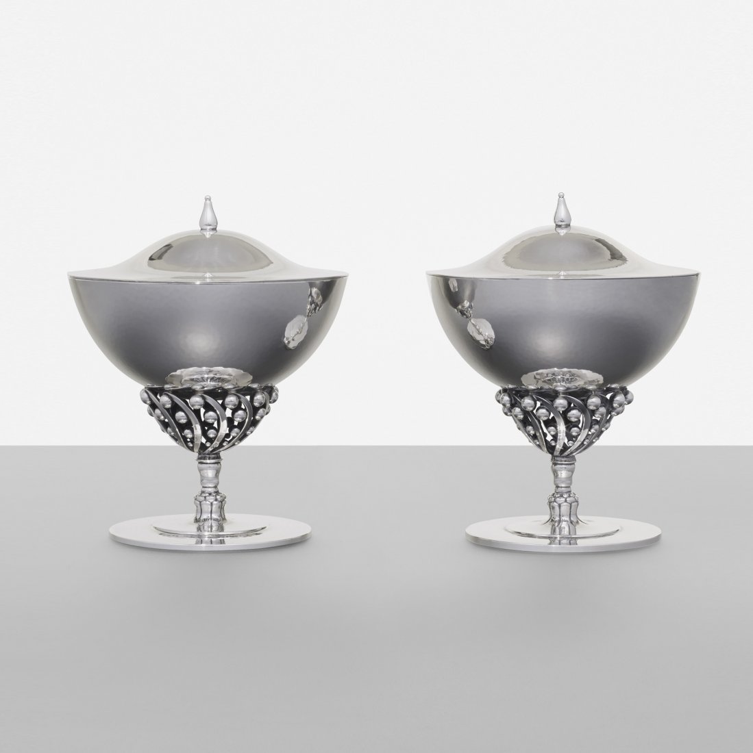 Johan Rohde footed Bonbonierre, pair: Johan Rohde footed Bonbonierre, pair Georg Jensen Denmark, 1908/c. 1945 sterling silver 5 dia x 6.25 h inches Signed with impressed manufacturer's mark to underside: [Denmark Georg Jensen Sterling Des
