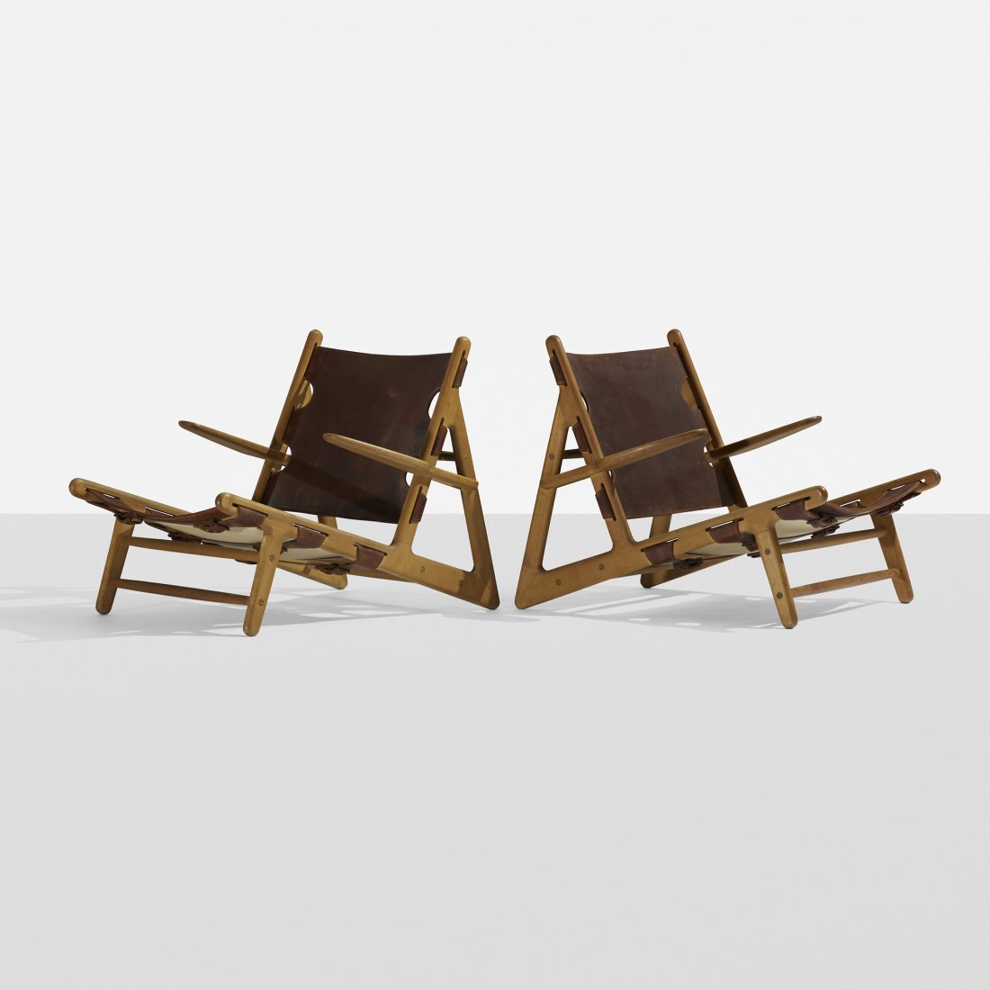 Børge Mogensen Hunting chairs, pair: Børge Mogensen Hunting chairs, pair Fredericia Stolefabrik Denmark, 1950 oak, leather, brass 27.75 w x 34.5 d x 26.5 h inches Signed with applied manufacturer's label to reverse: [Fredericia]. Litera