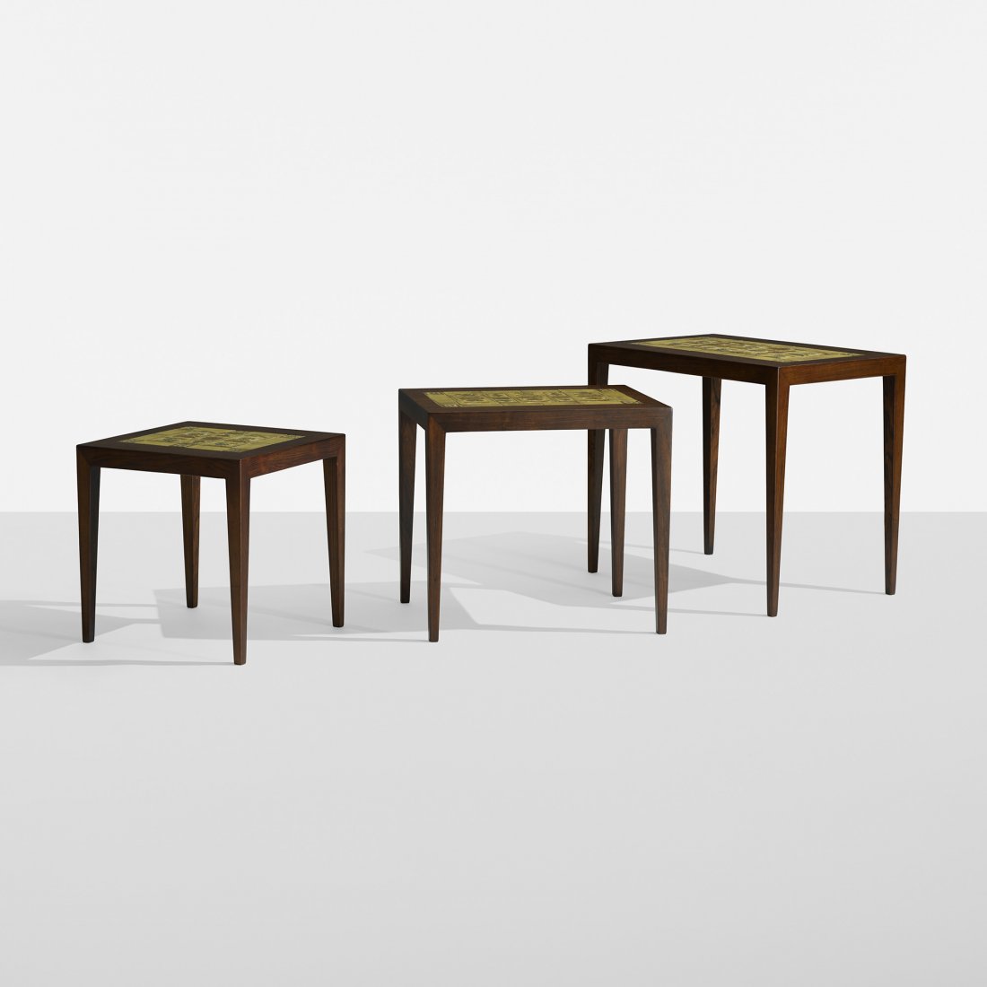 Severin Hansen nesting tables, set of three: Severin Hansen nesting tables, set of three Haslev Møbelsnedkeri A/S Denmark, c. 1960 rosewood, porcelain 22.5 w x 14.5 d x 19.25 h inches The tiles on these tables were manufactured by Royal Copenha