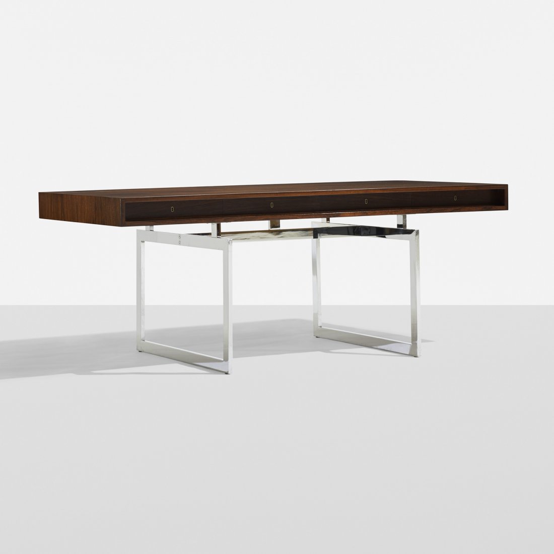 Bodil Kjaer desk: Bodil Kjaer desk E. Pederson and Sons A/S Denmark, c. 1960 rosewood, chrome-plated steel, brass 72.5 w x 36 d x 29 h inches Desk features four drawers. Signed with stamped manufacturer's mark to under