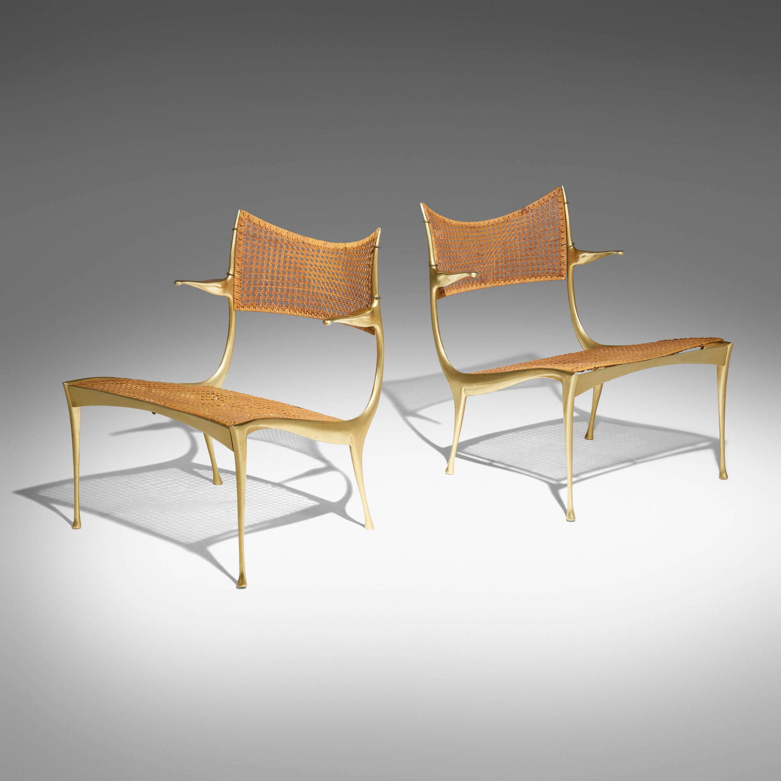 Dan Johnson, Gazelle lounge chairs model 30B: Dan Johnson Gazelle lounge chairs model 30B Dan Johnson StudioUSA / Italy, 1955gilt aluminum, cane 27 h x 22.5 w x 22.5 d in (69 x 57 x 57 cm) Provenance: Private Collec