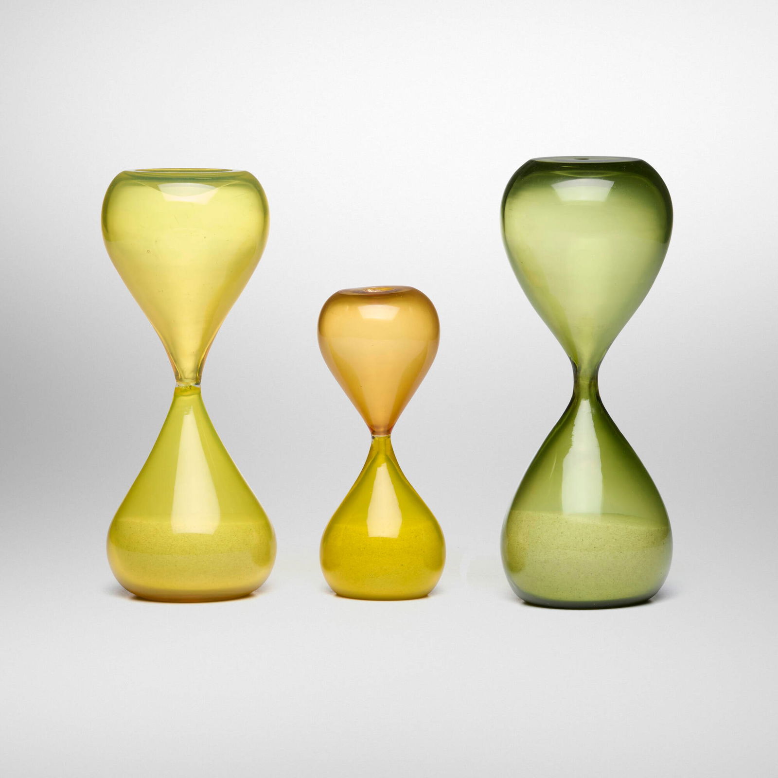 Paolo Venini, Clessidre (Hourglasses), set of three: Paolo Venini Clessidre (Hourglasses), set of three VeniniItaly, c. 1955 / produced laterglass, sand 8 h x 3.125 dia in (20 x 8 cm) 7.625 h x 3.125 dia in (19 x 8 cm) 5.5 h x 2.25 dia in (