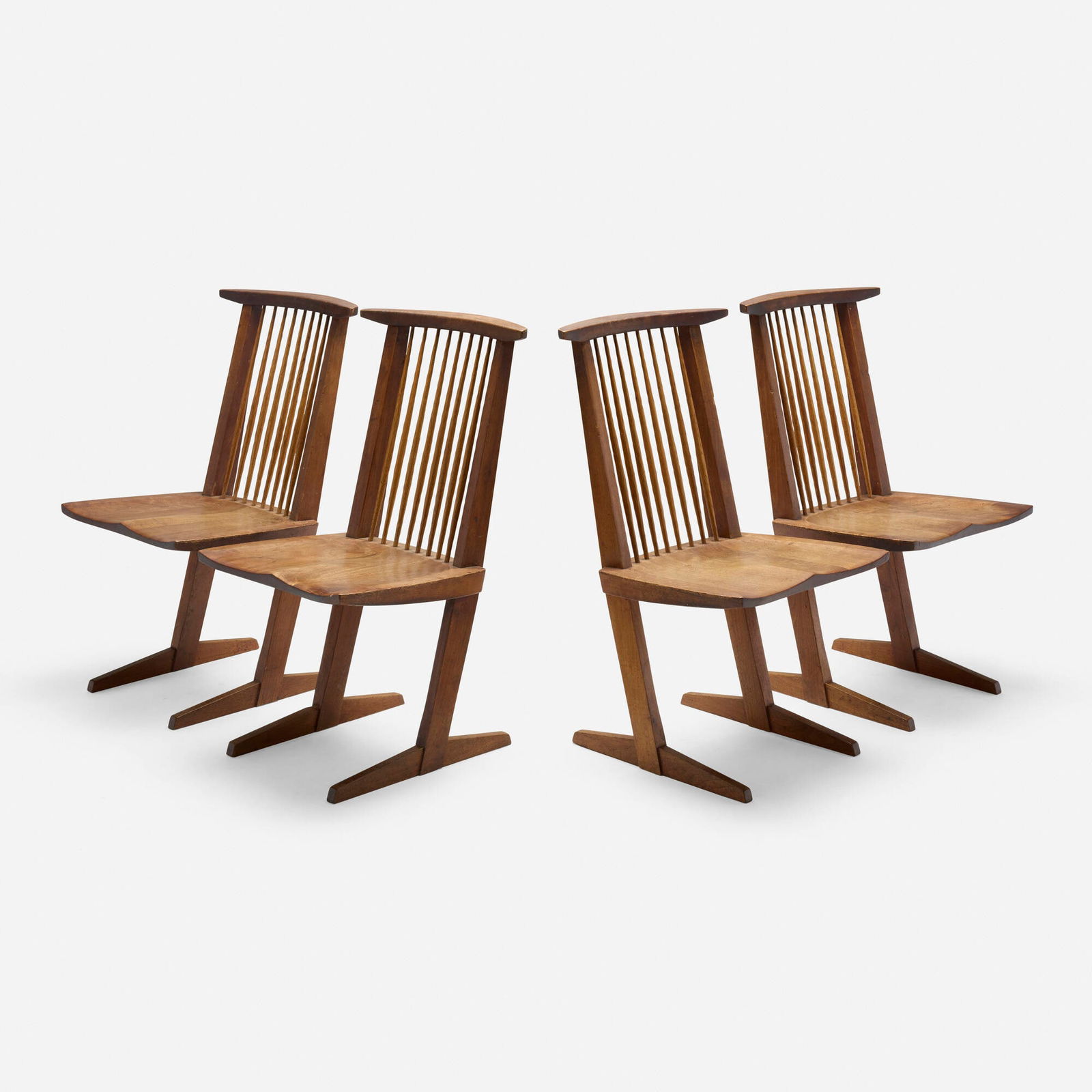 George Nakashima, Conoid chairs, set of four: George Nakashima Conoid chairs, set of four Nakashima Studio USA, 1965-66 American black walnut, hickory 35.5 h x 20.75 w x 22 d in (90 x 53 x 56 cm) Inscribed with client's name to underside of