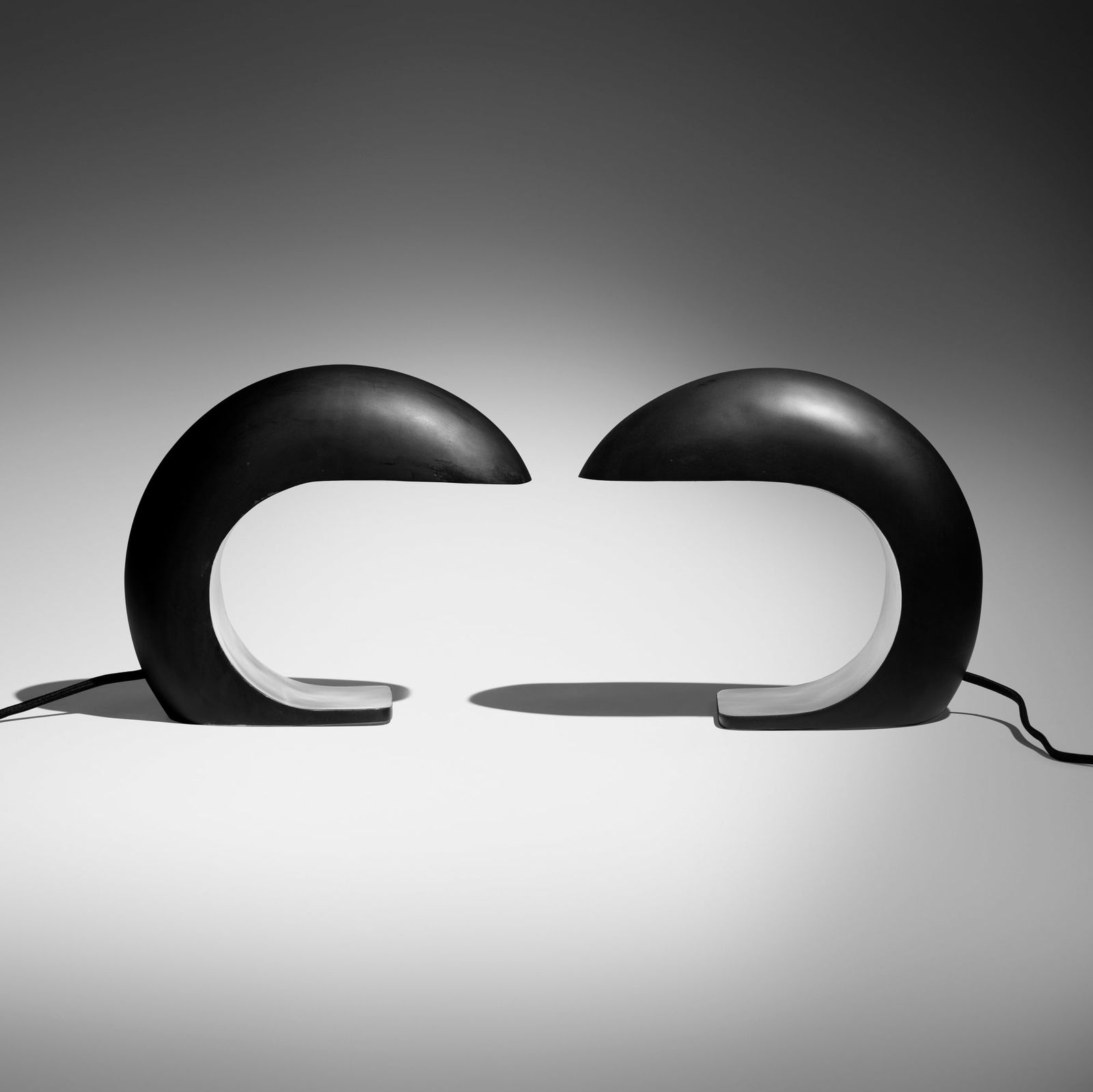 Christopher Kreiling, Nautilus Study desk lamps, pair: Christopher Kreiling Nautilus Study desk lamps, pair USA, 2018 patinated and polished stainless steel 11 h x 5.5 w x 12.5 d in (28 x 14 x 32 cm) Etched signature to lower edge of one example 'C