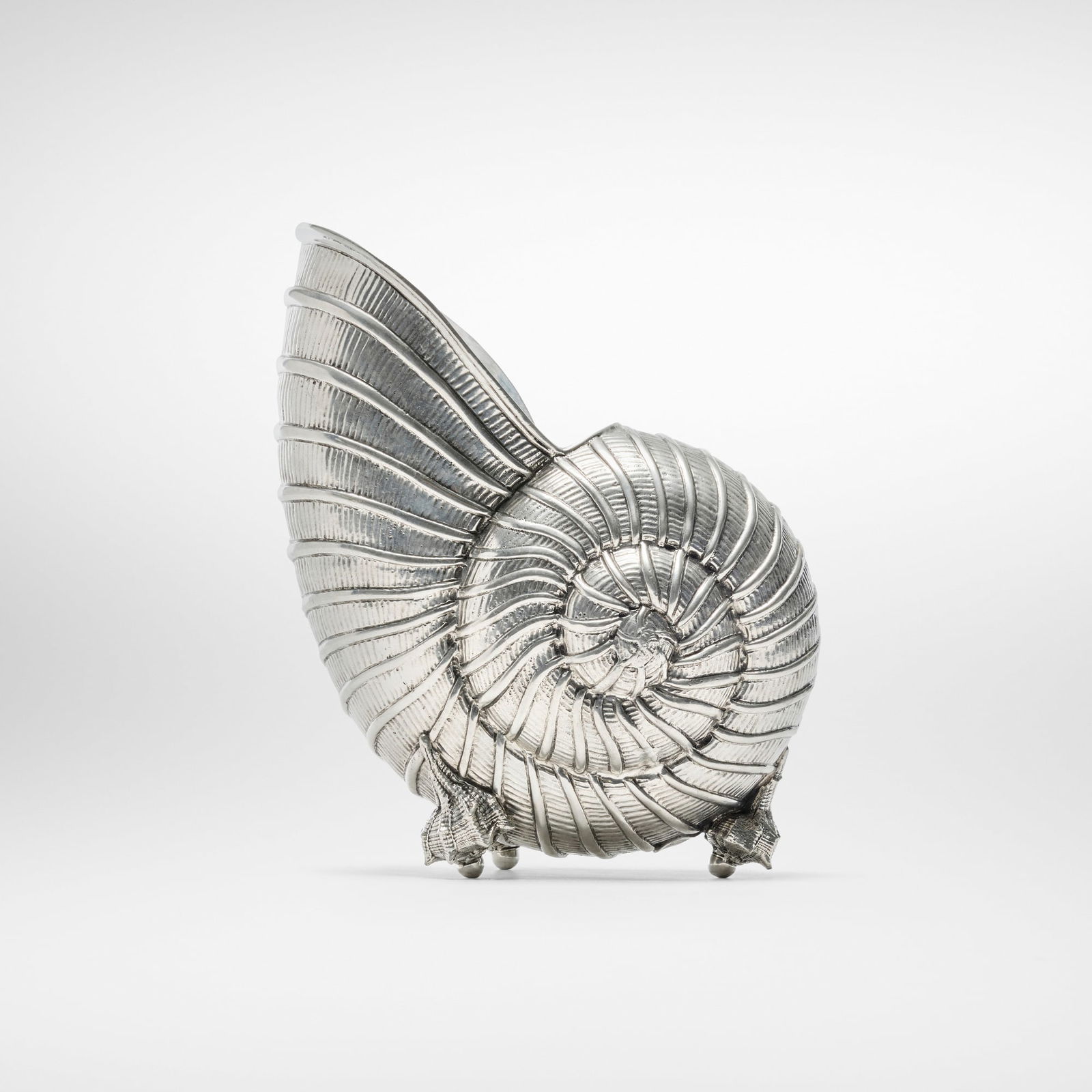 Giovanni Patrini, Nautilus shell wine cooler: Giovanni Patrini Nautilus shell wine cooler Atena Italy, c. 1980 pewter 10.75 h x 8.5 w x 5.5 d in (27 x 22 x 14 cm) Impressed manufacturer's mark to underside 'Giovanni Patrini per Atena'. 